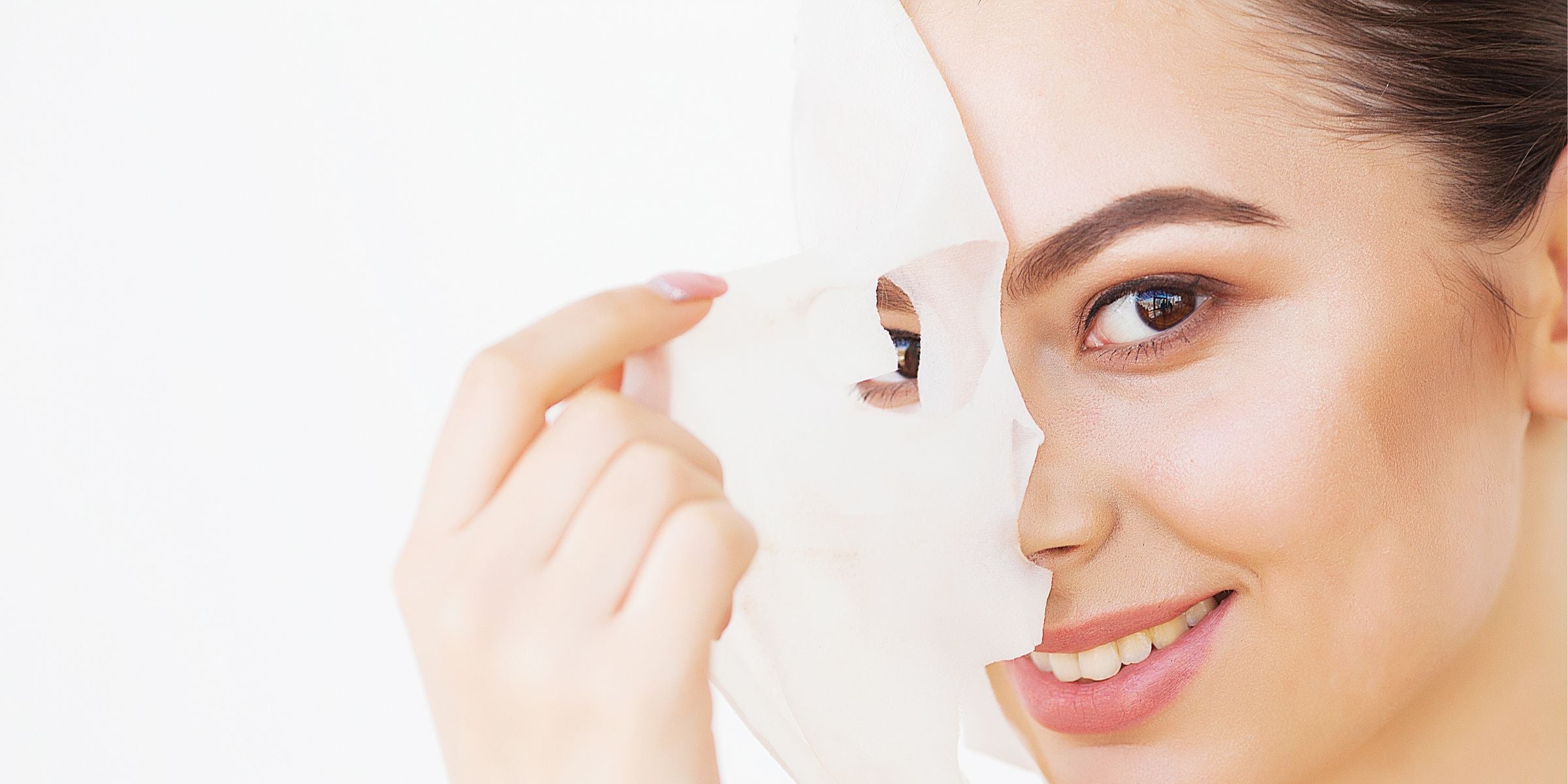 Lady removing face mask sheet