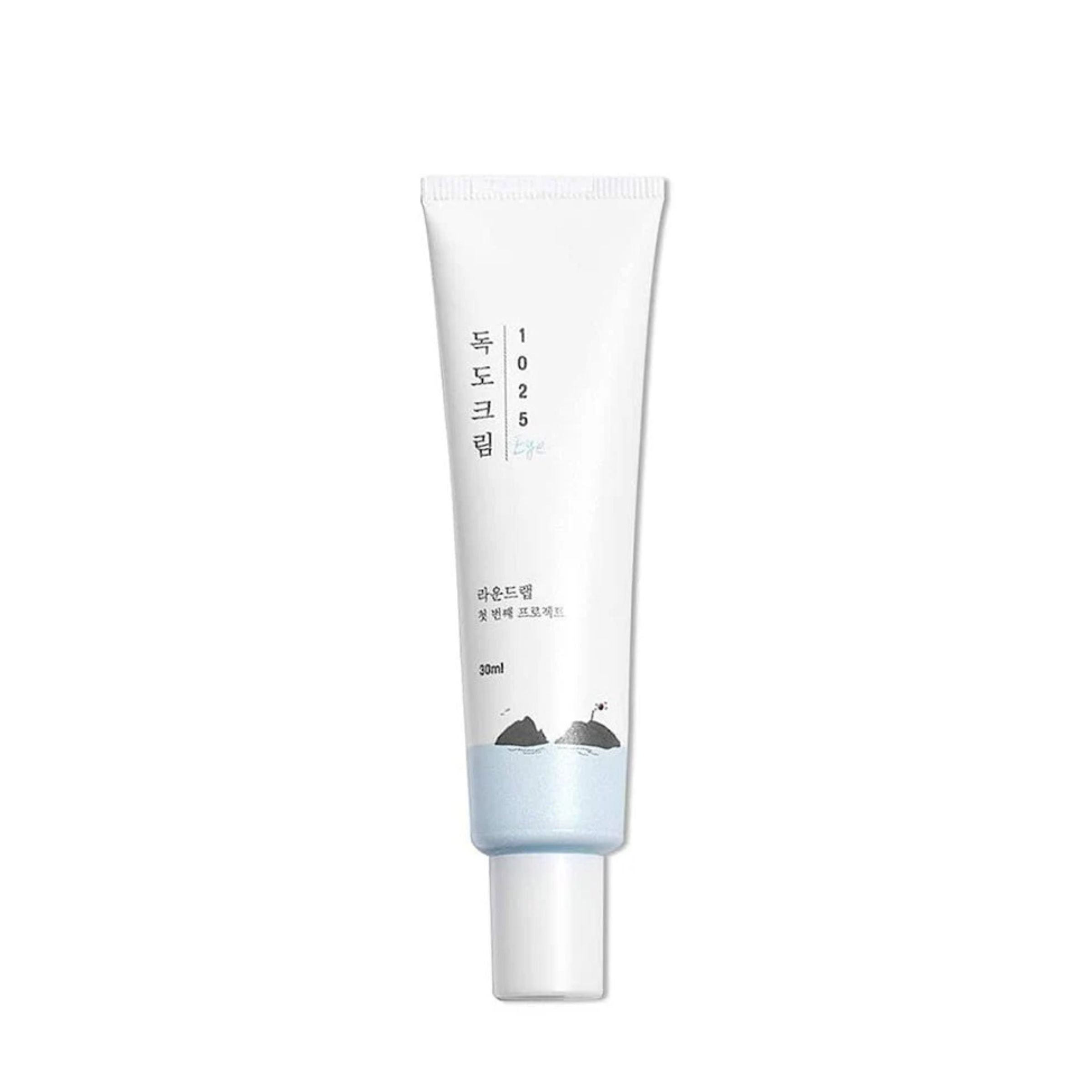 Skincare tube with white cap on a white background
