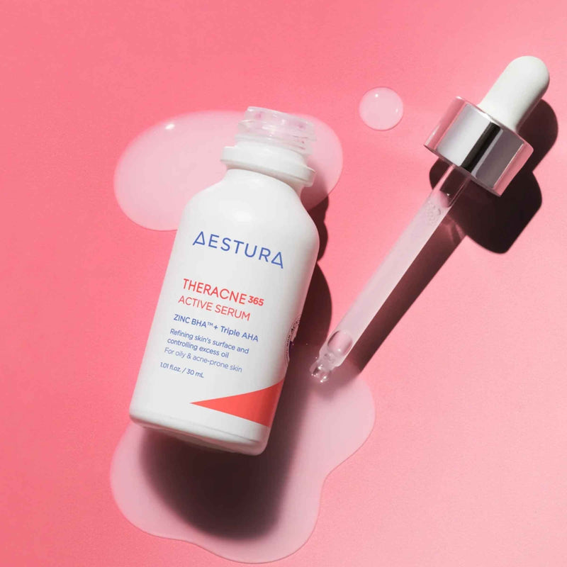 Aestura Theracne MS Active Serum bottle with dropper on a pink background