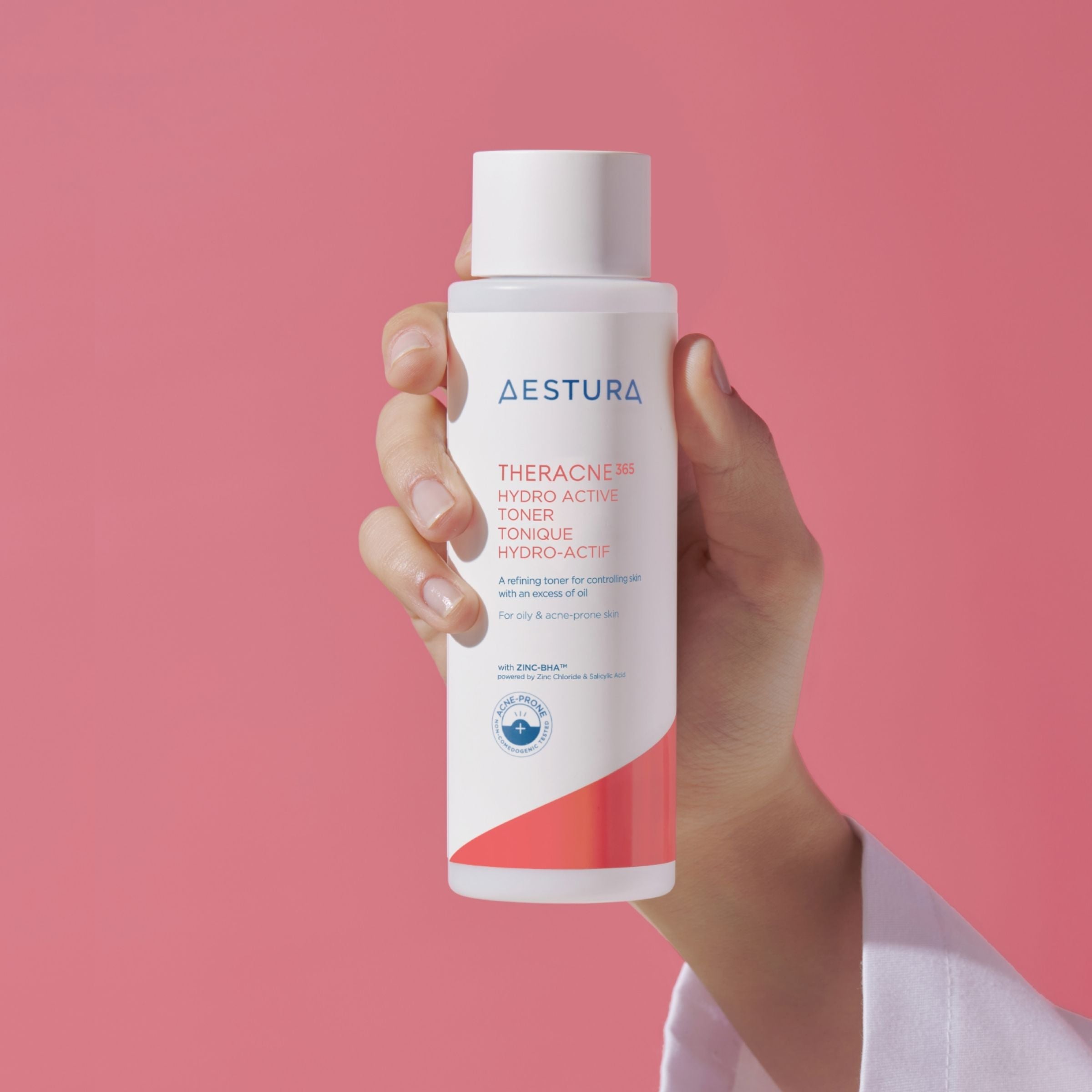 Skincare product with a blue sponge and foam on a light blue background