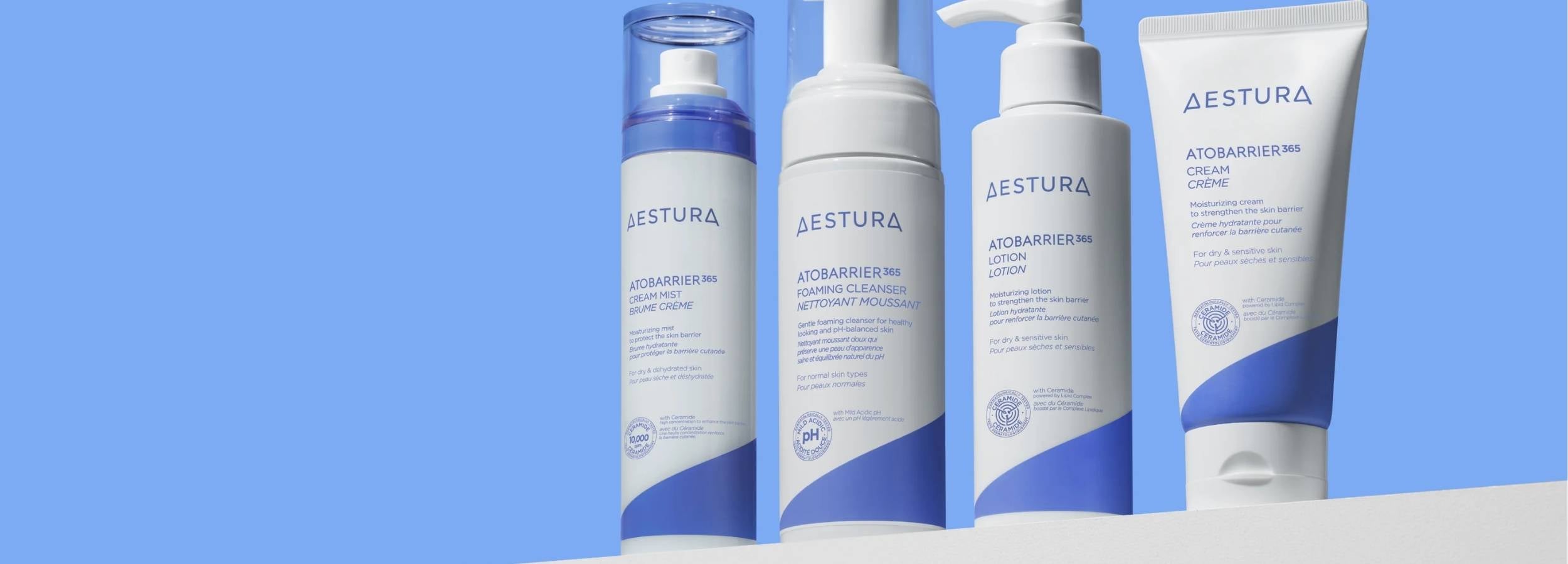 Aestura skincare products on a blue background