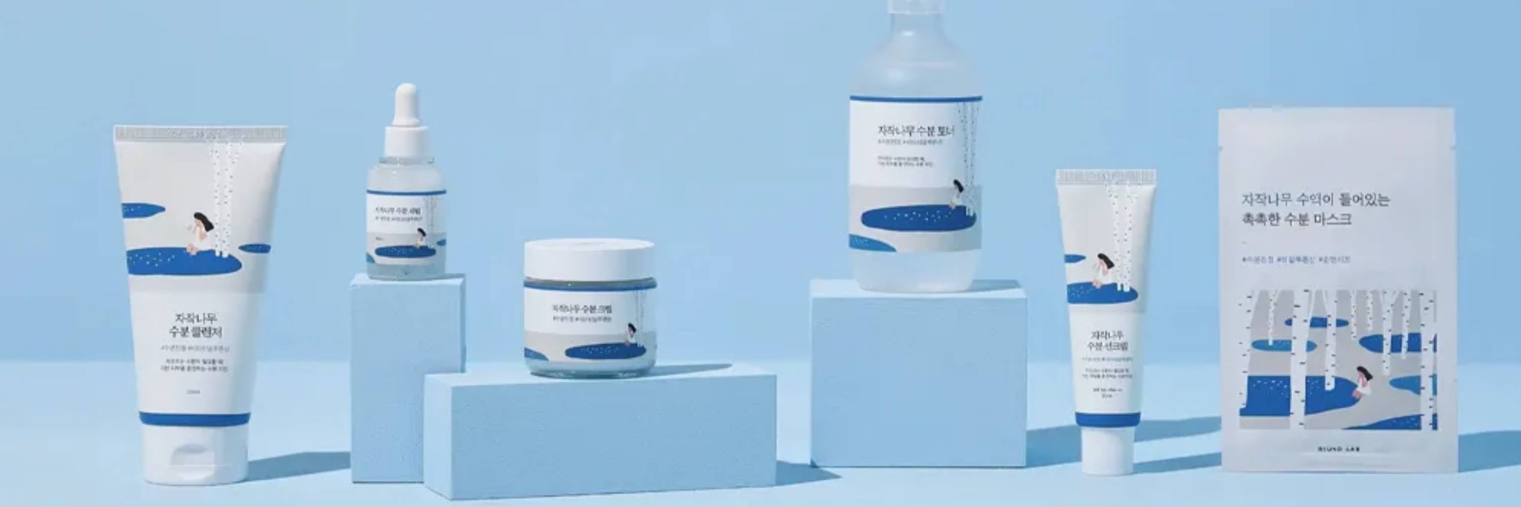 Set of Round Lab skincare products on a blue background