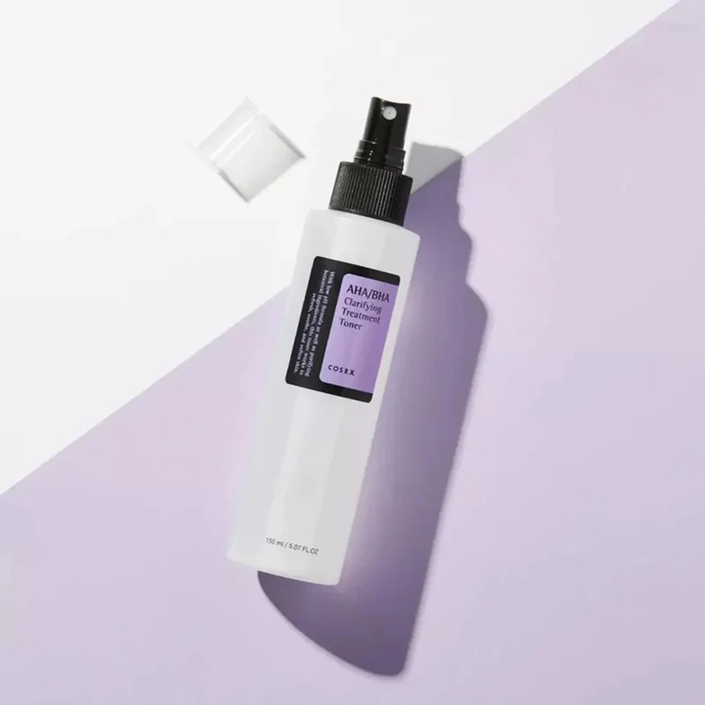 Two Aestura Retinoid Eye Serum tubes on a purple background