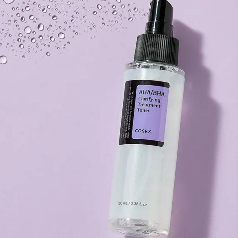 Cosrx toner bottle on a purple background with water droplets