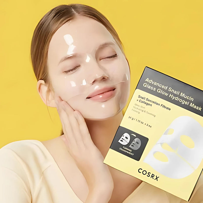 Woman wearing a COSRX snail mucin glass glow hydrogel mask with a yellow background