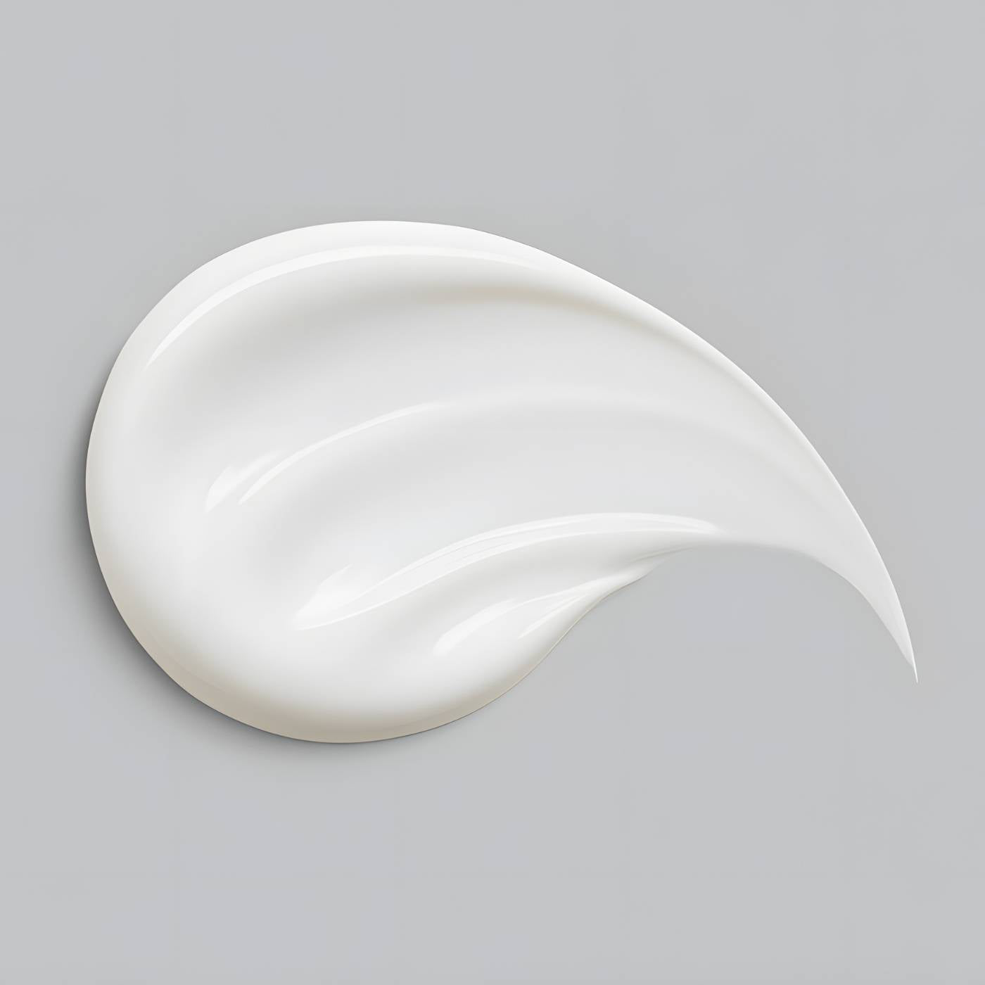 White suncream swatch on a grey background