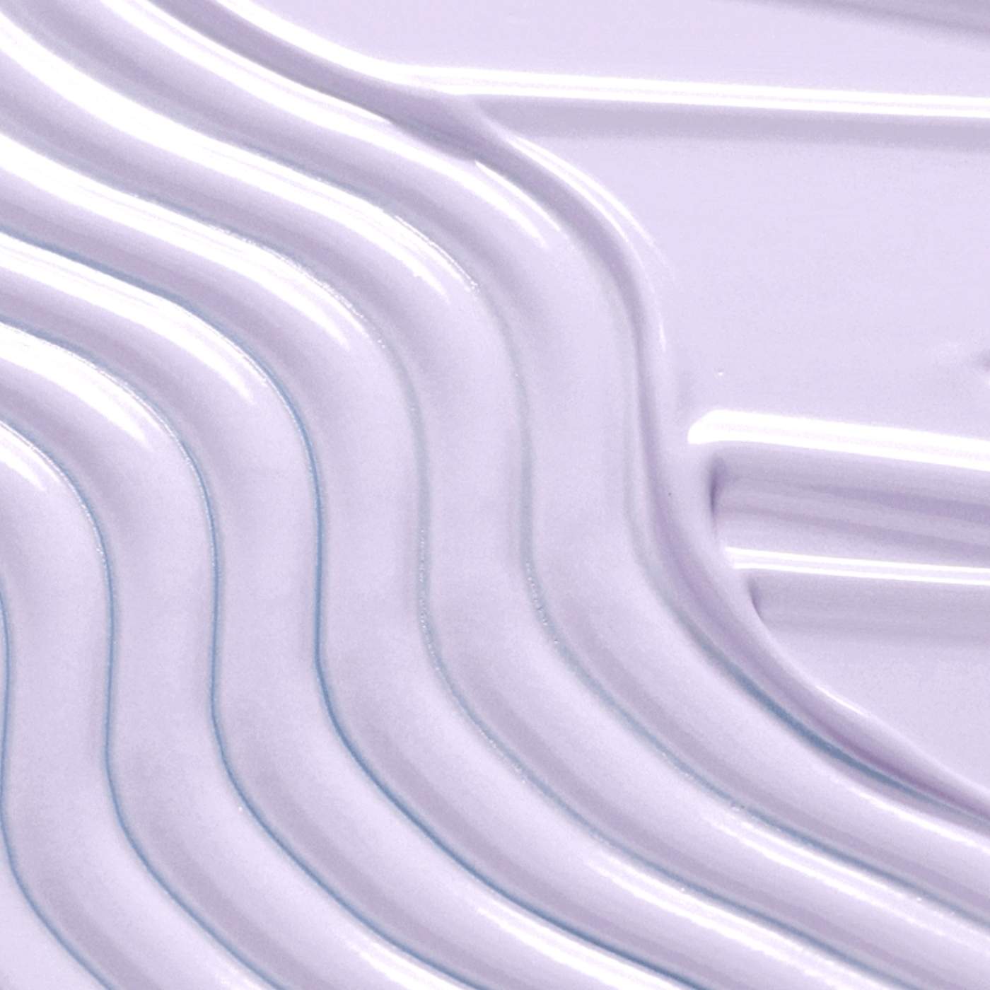 Close-up of a light purple suncream swatch with wavy texture