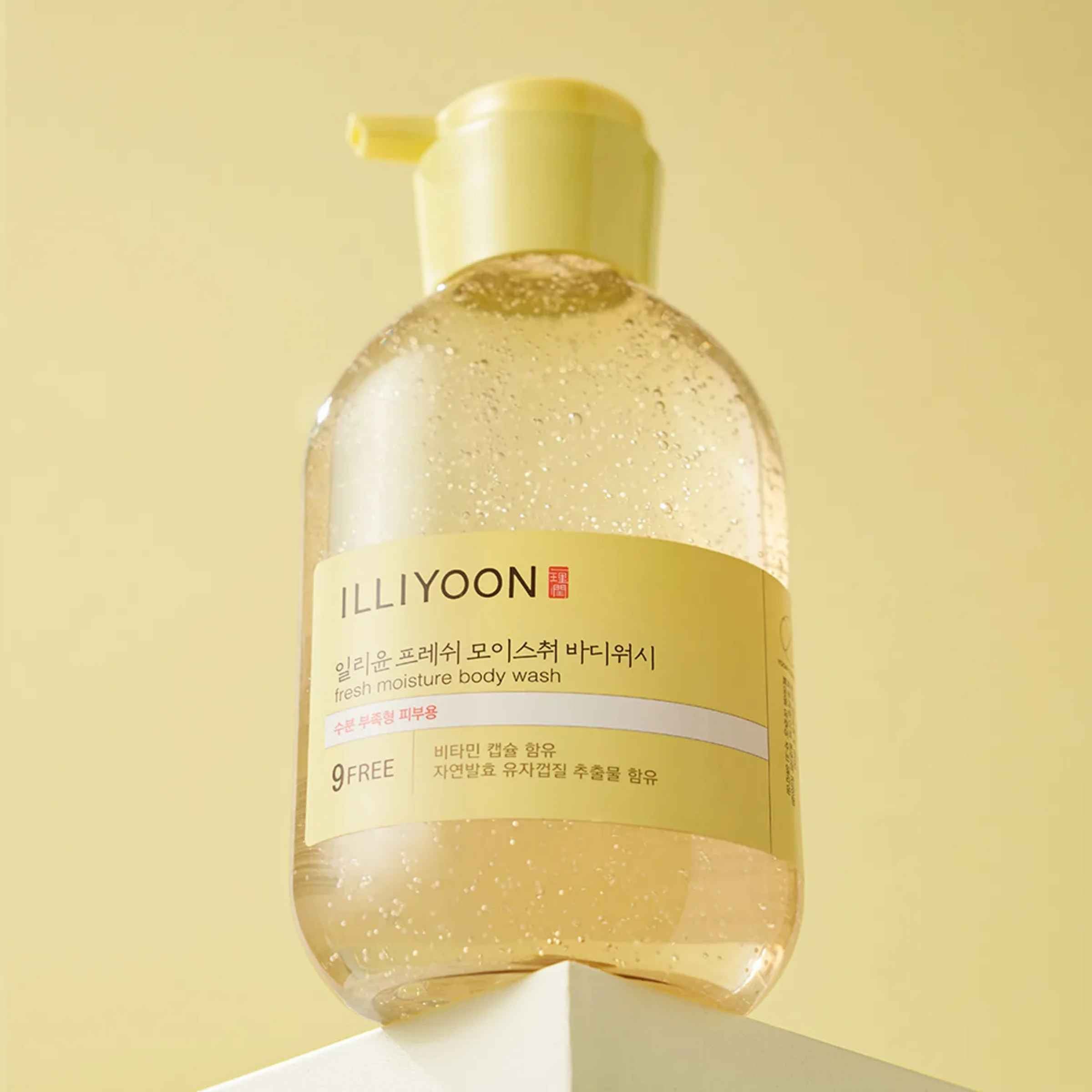 Bottle of Illiyoon body wash on a light yellow background