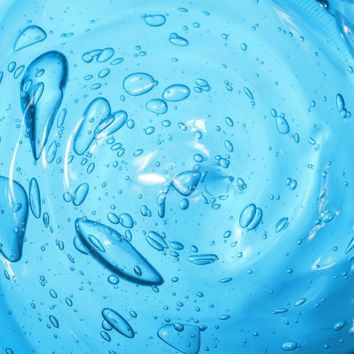 Close-up of water droplets on a blue surface