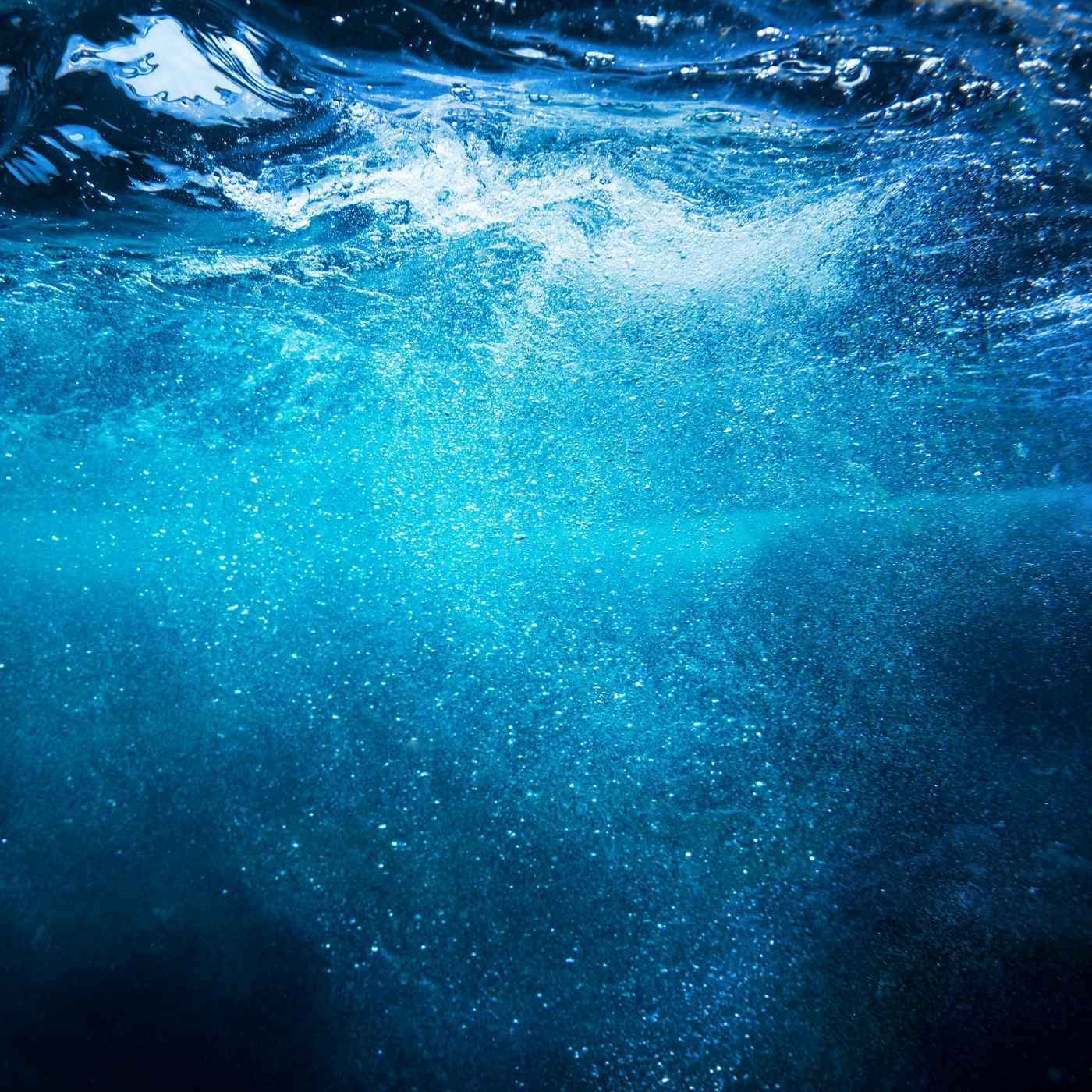 Underwater view with bubbles and blue water