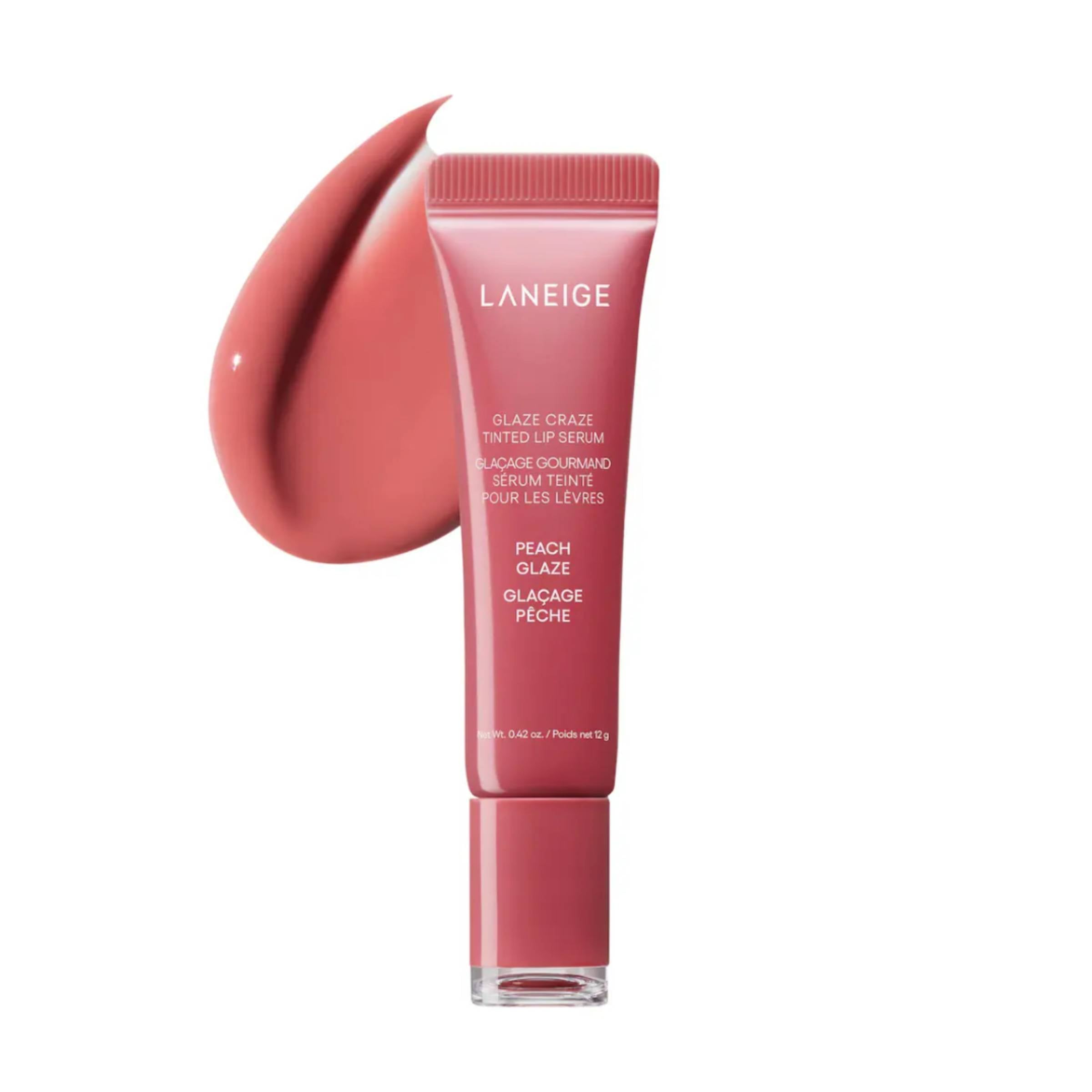 Laneige lip serum with a swatch of peach glaze on a white background
