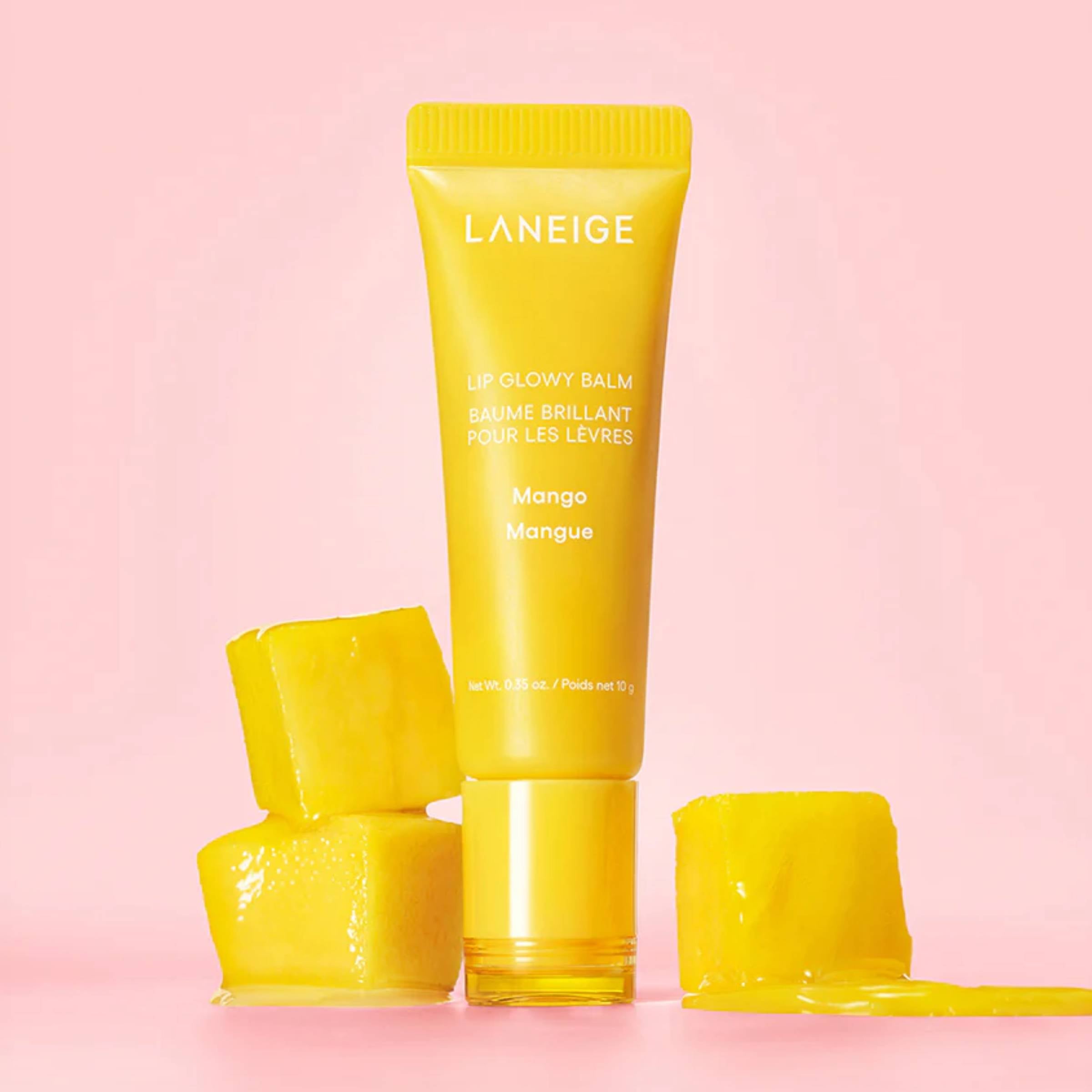 Yellow Laneige lip balm tube on a pink background