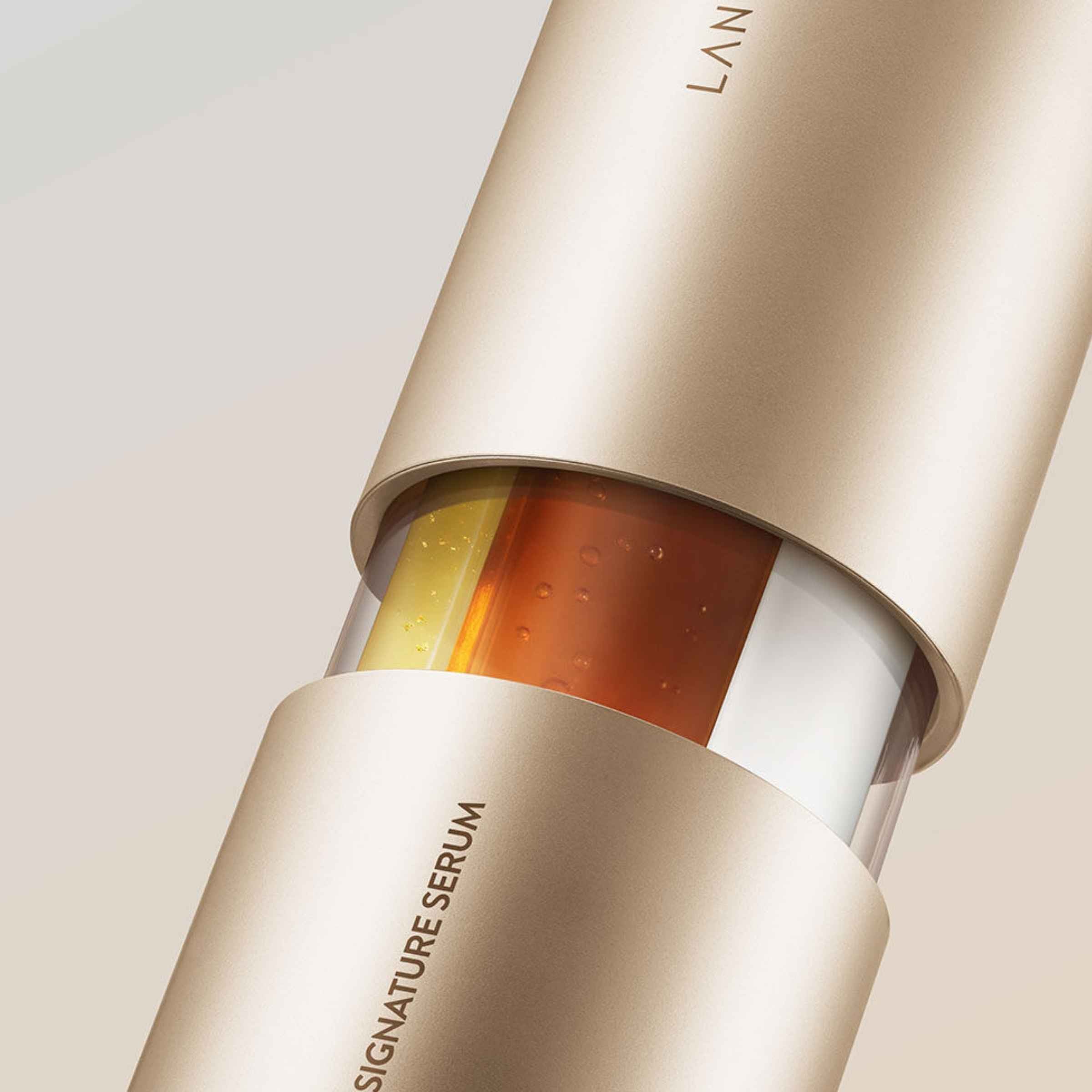 Close-up of a skincare serum bottle with visible branding on a neutral background