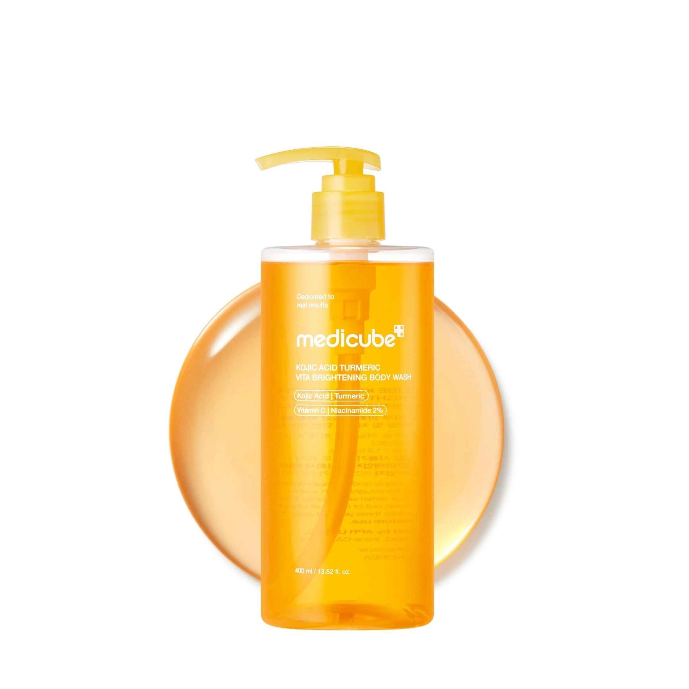 Orange bottle with pump dispenser on a white background