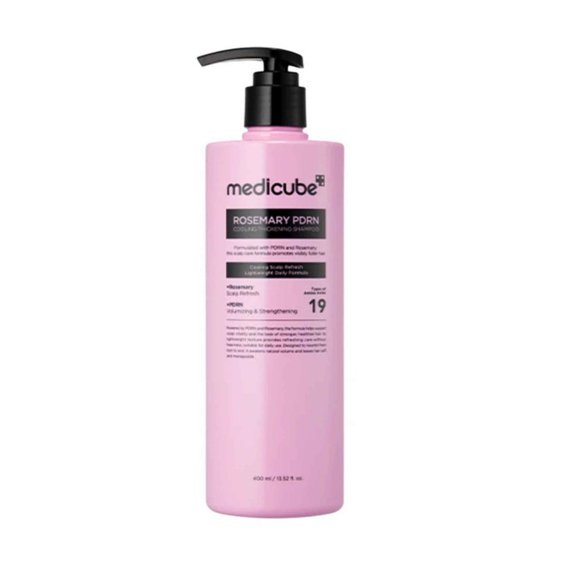 Pink bottle of Medicube Rosemary Forn on a white background