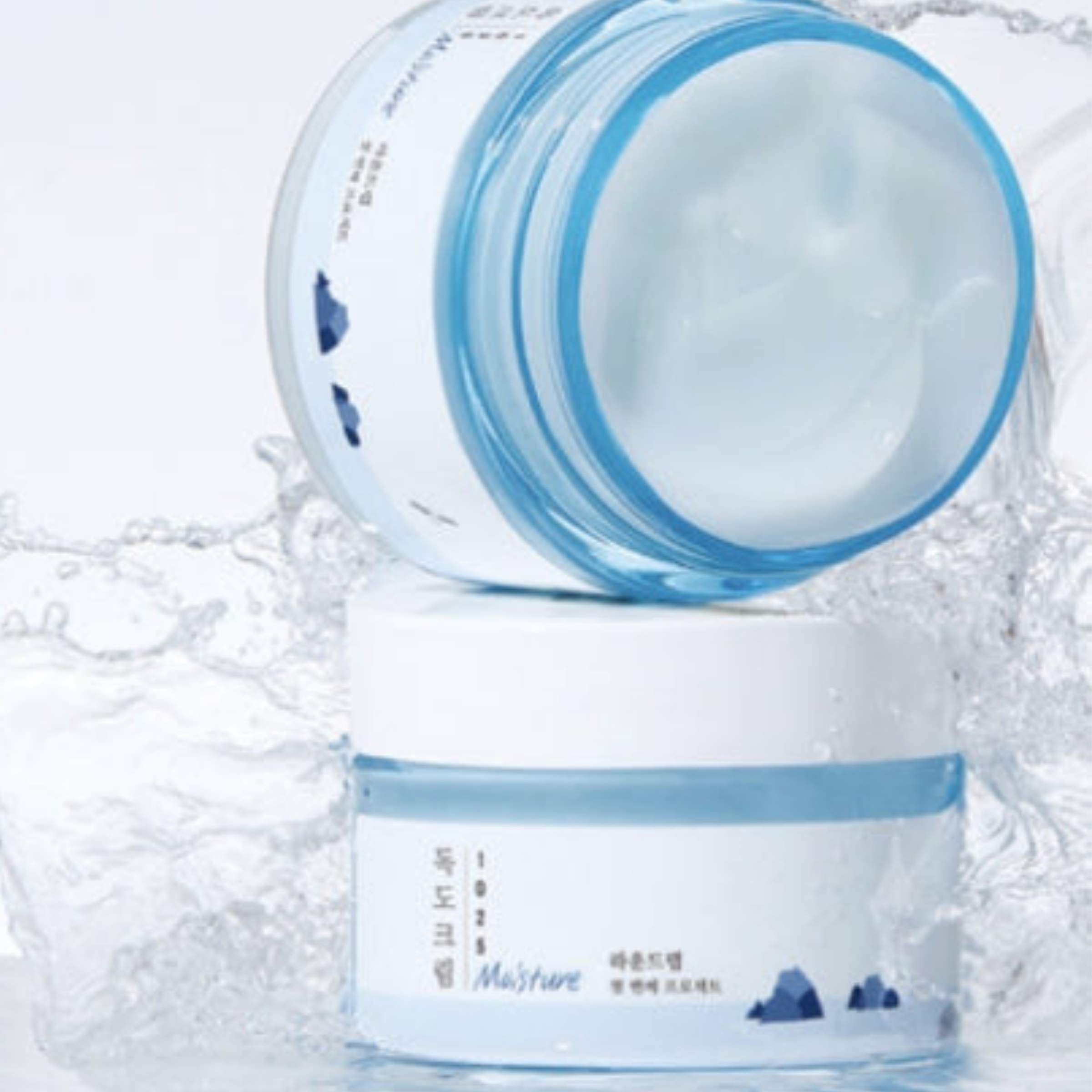 Cosmetic jar with blue lid on a white background