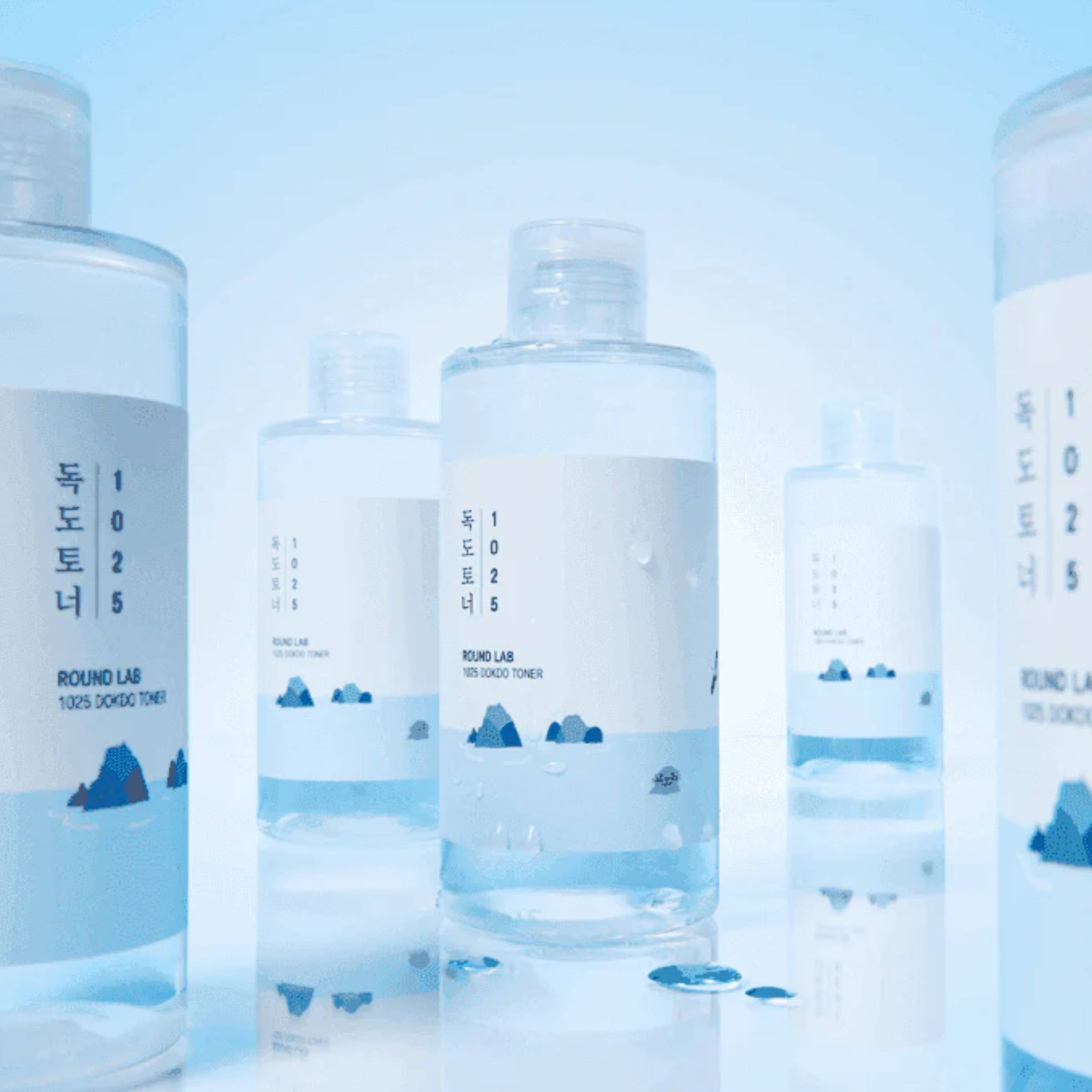 Round Lab 1025 Dokdo Toner bottles on a blue background