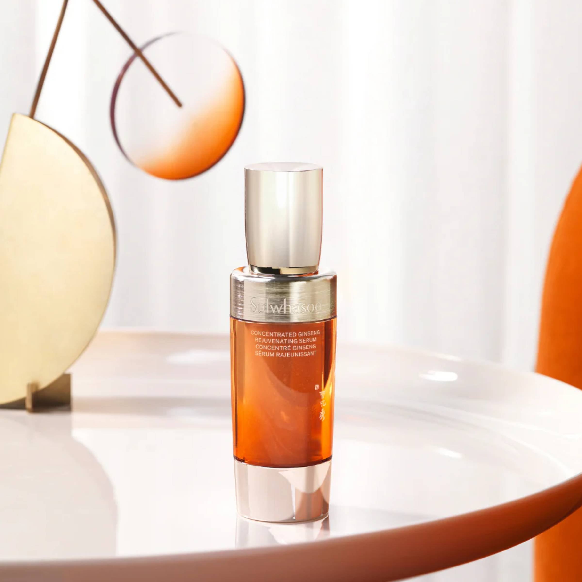 Sulwhasoo serum bottle on a white surface with a blurred background