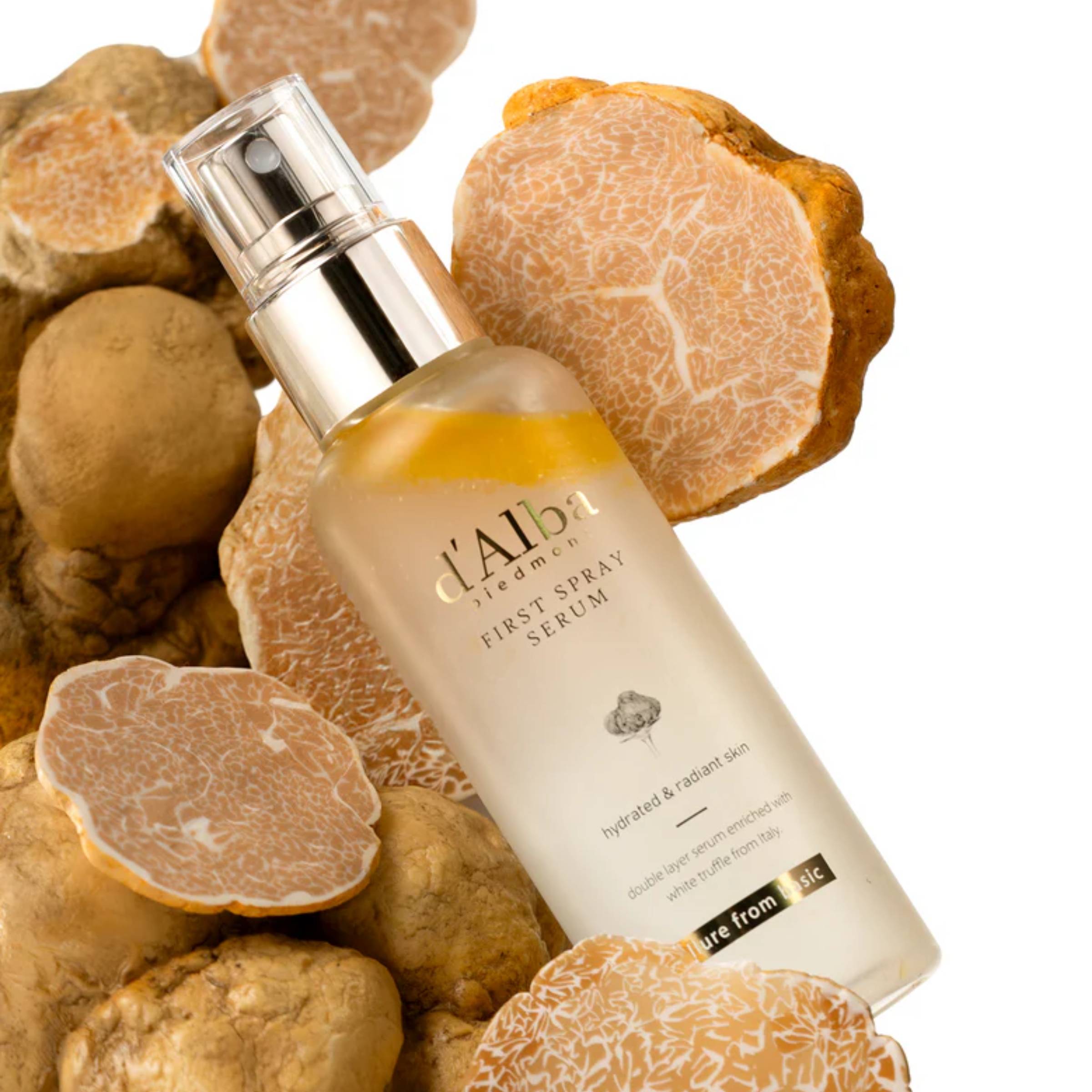 L'Alba skincare serum bottle with truffle background