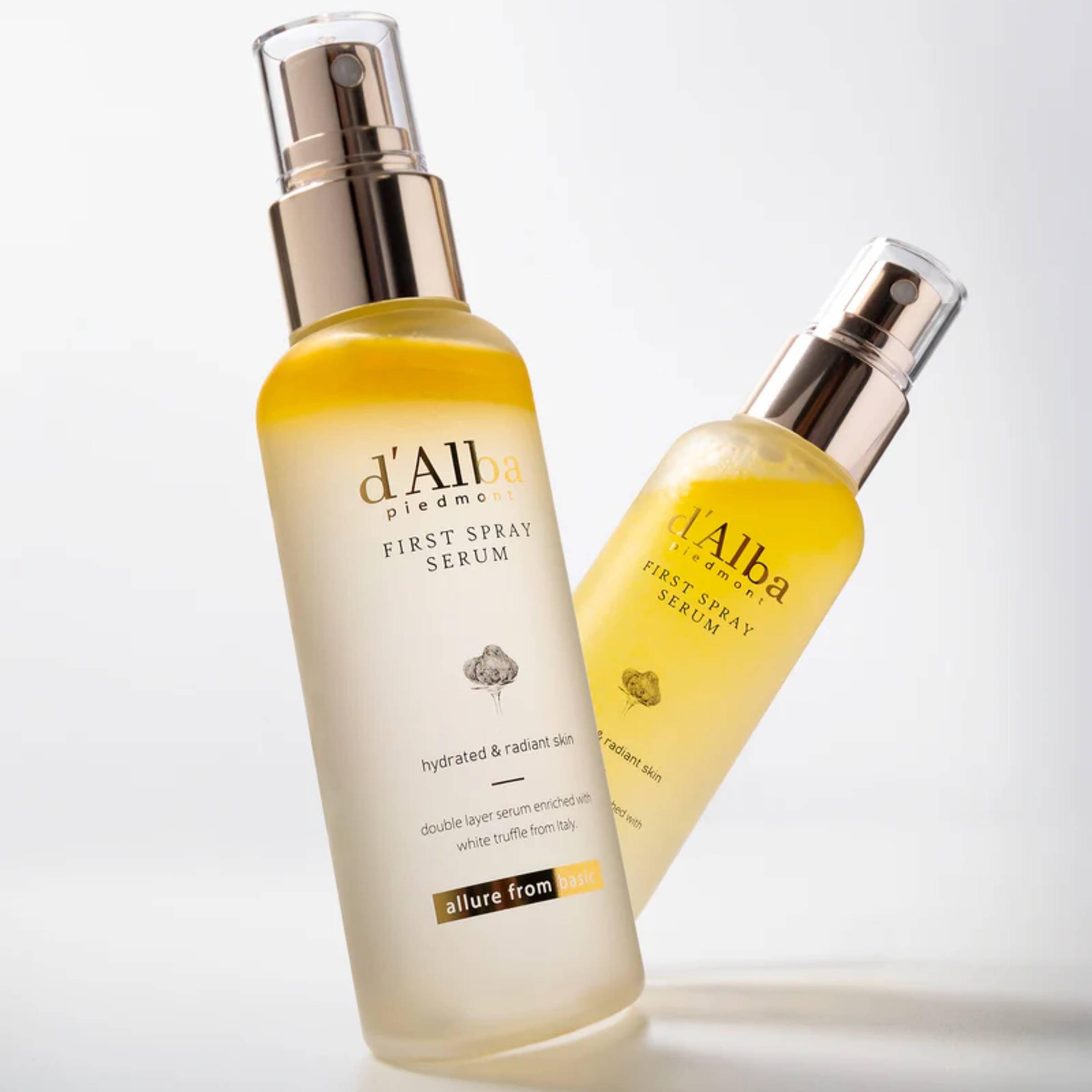 Two bottles of d'Alba First Spray Serum on a light gray background