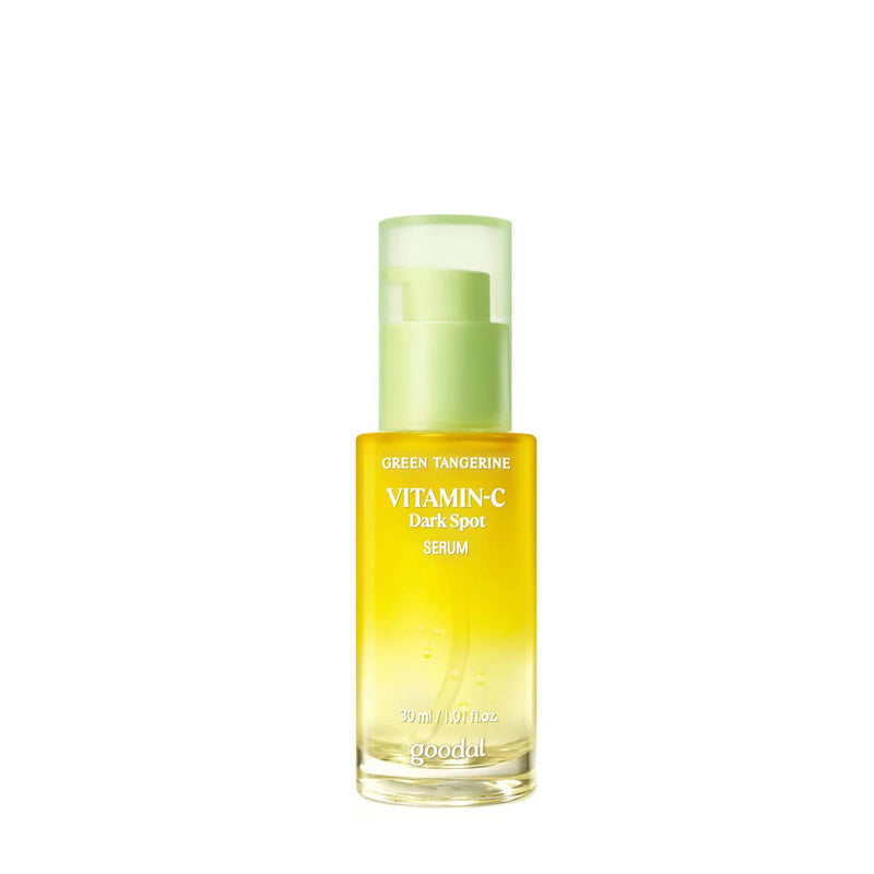 Vitamin C serum bottle with green cap on a white background
