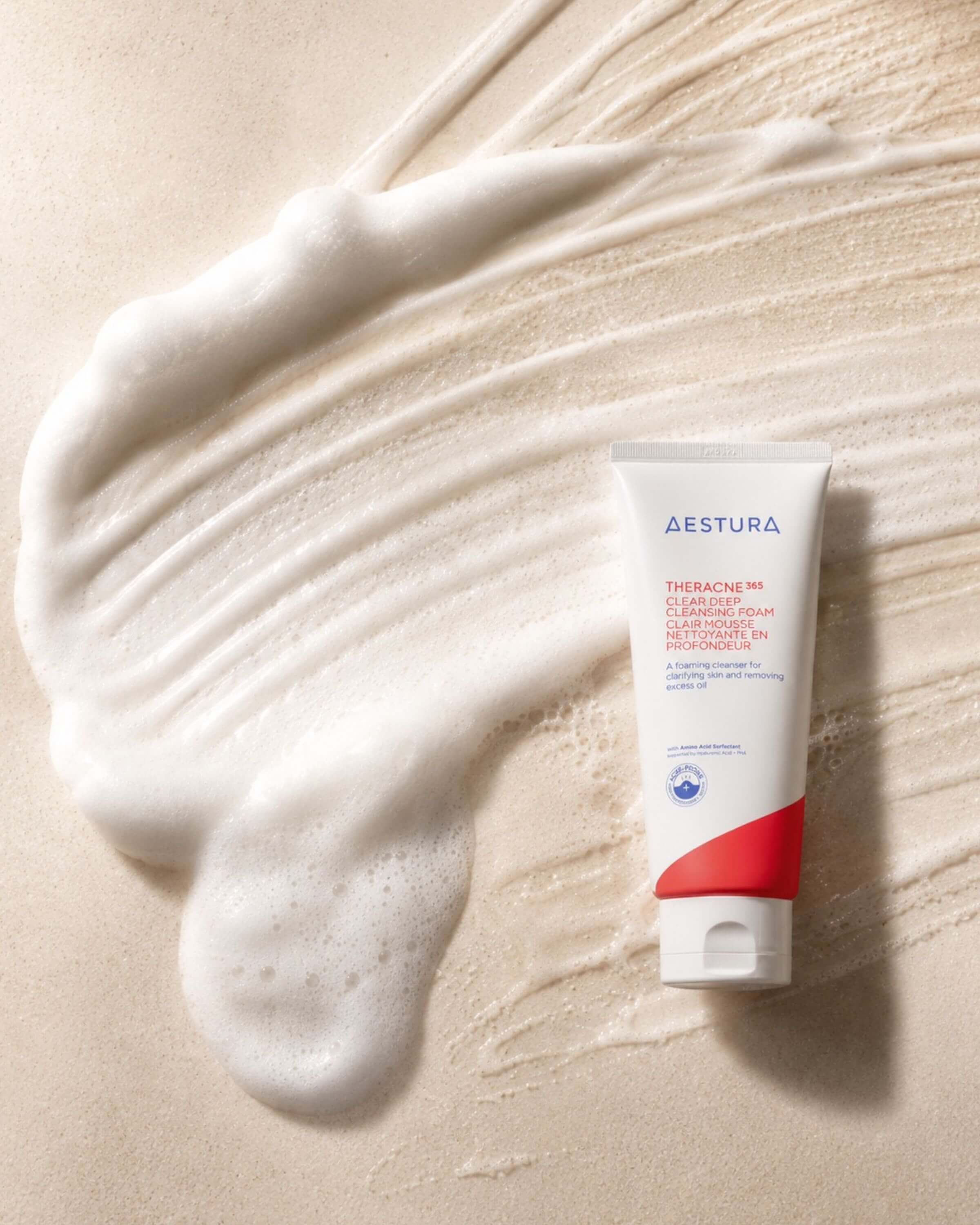 Aestura Theracne 365 Clear Deep Cleansing Foam on a beige background with foam swatch