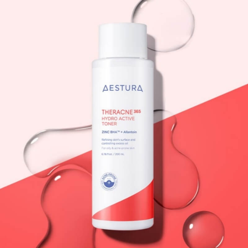 Aestura Theracne 365 Hydro Active Toner bottle on a red and pink background