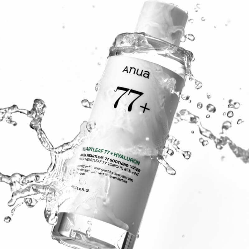 ANUA Heartleaf 77 Soothing Toner with water splashes on a white background