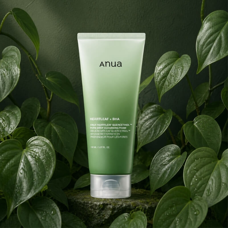 ANUA Heartleaf Cleansing Foam surrounded by heartleaf on a green background