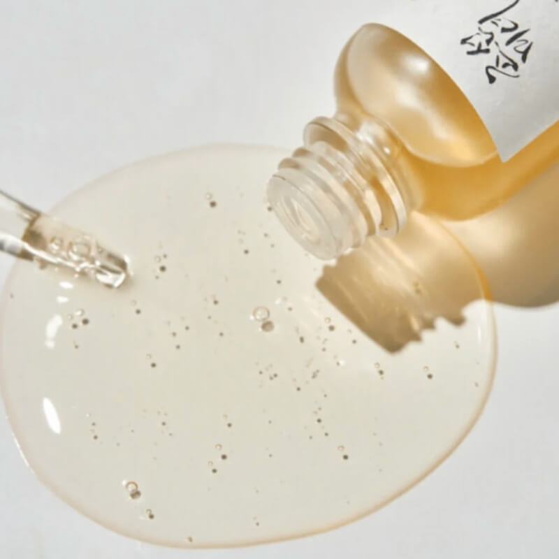 Close-up of Beauty of Joseon Glow Serum Propolis + Niacinamide with a beige liquid on a white background