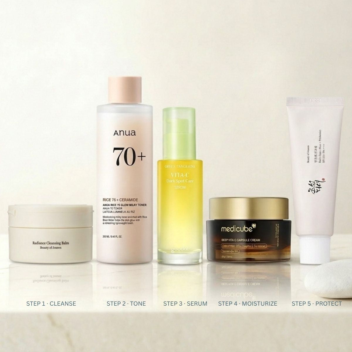 Korean skincare products for brightening routine on marble surface
