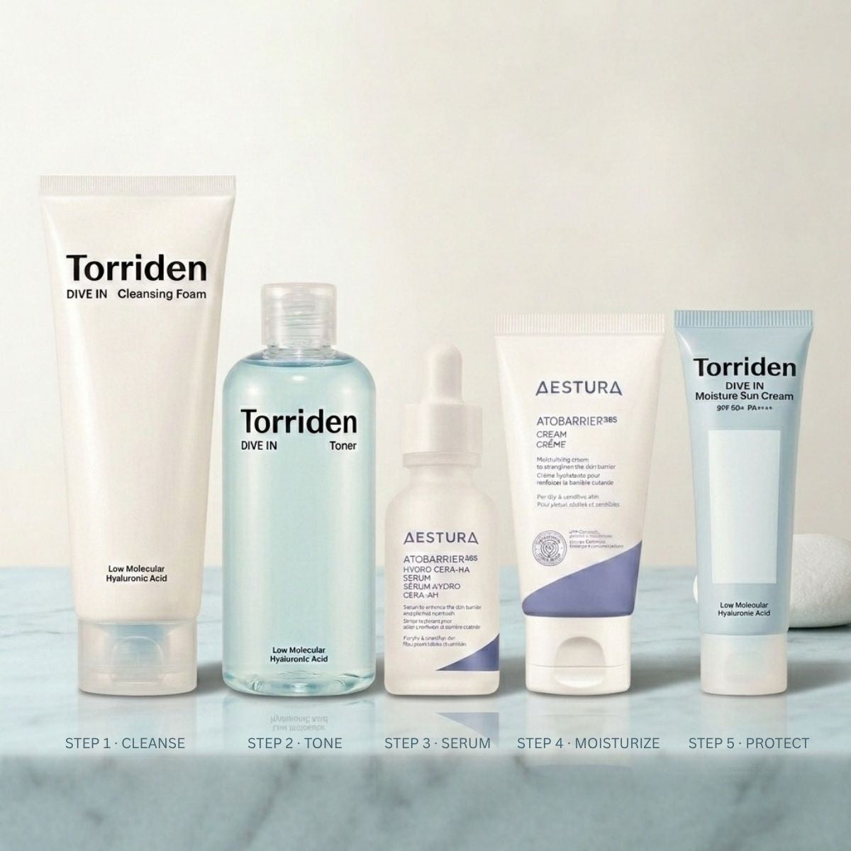 Korean skincare products for hydration routine on marble surface