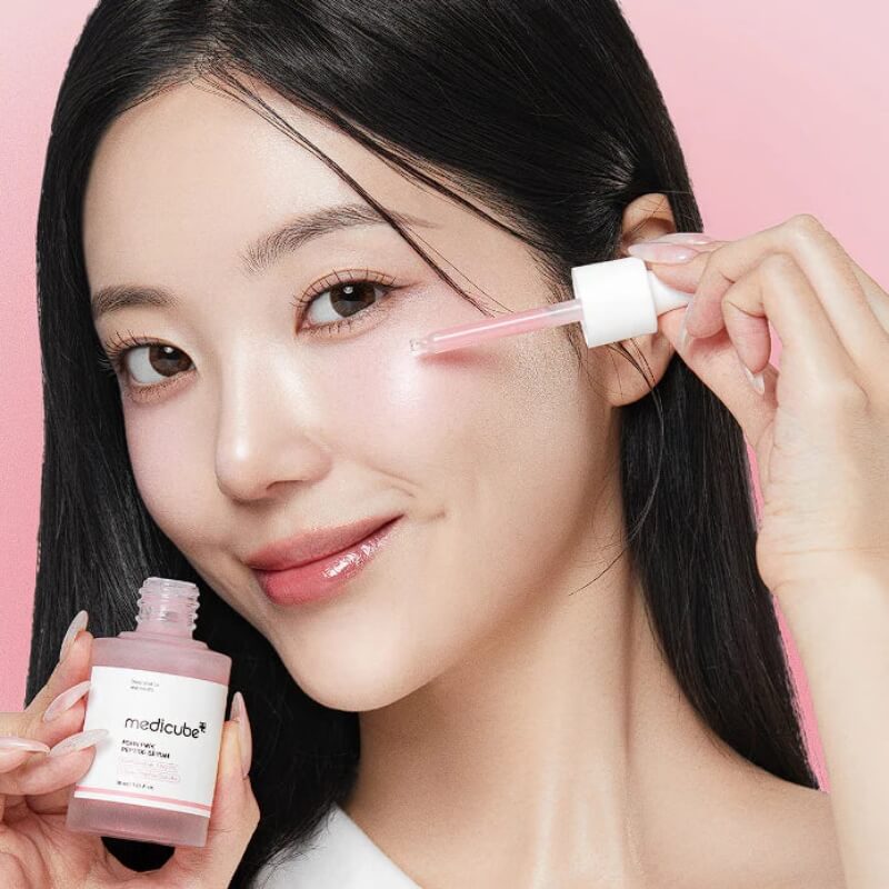 Medicube PDRN Pink Peptide Serum in K-beauty anti-aging routine lady applying serum