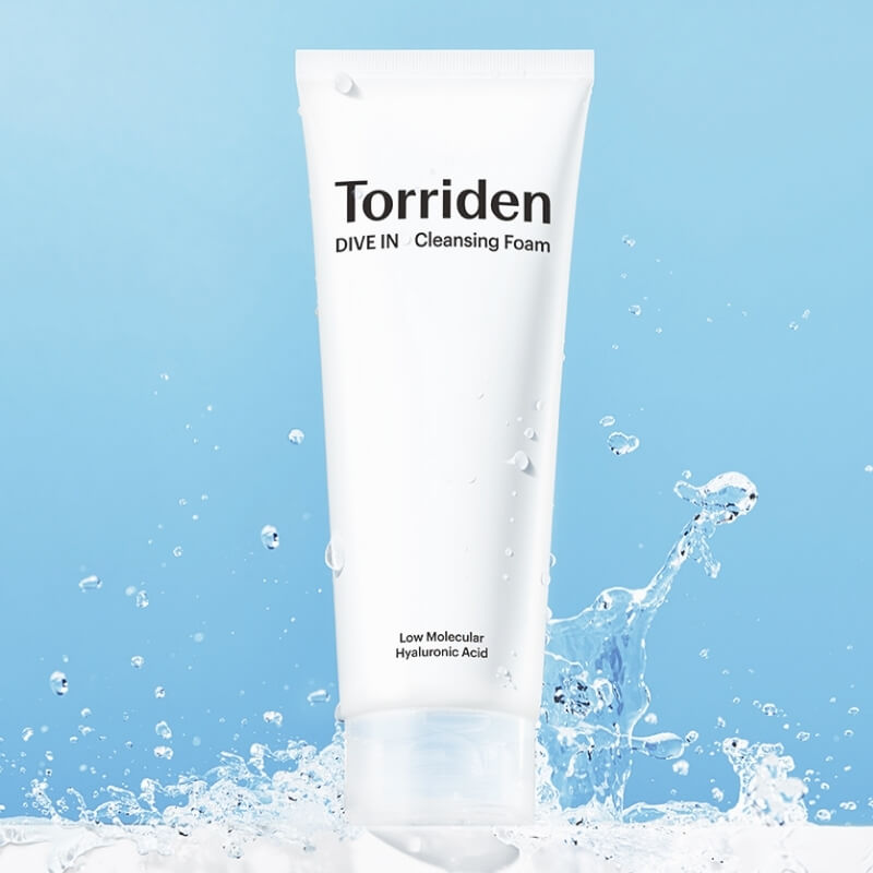 Torriden Dive In Hyaluronic Acid Cleansing Foam with water splashes on a blue background