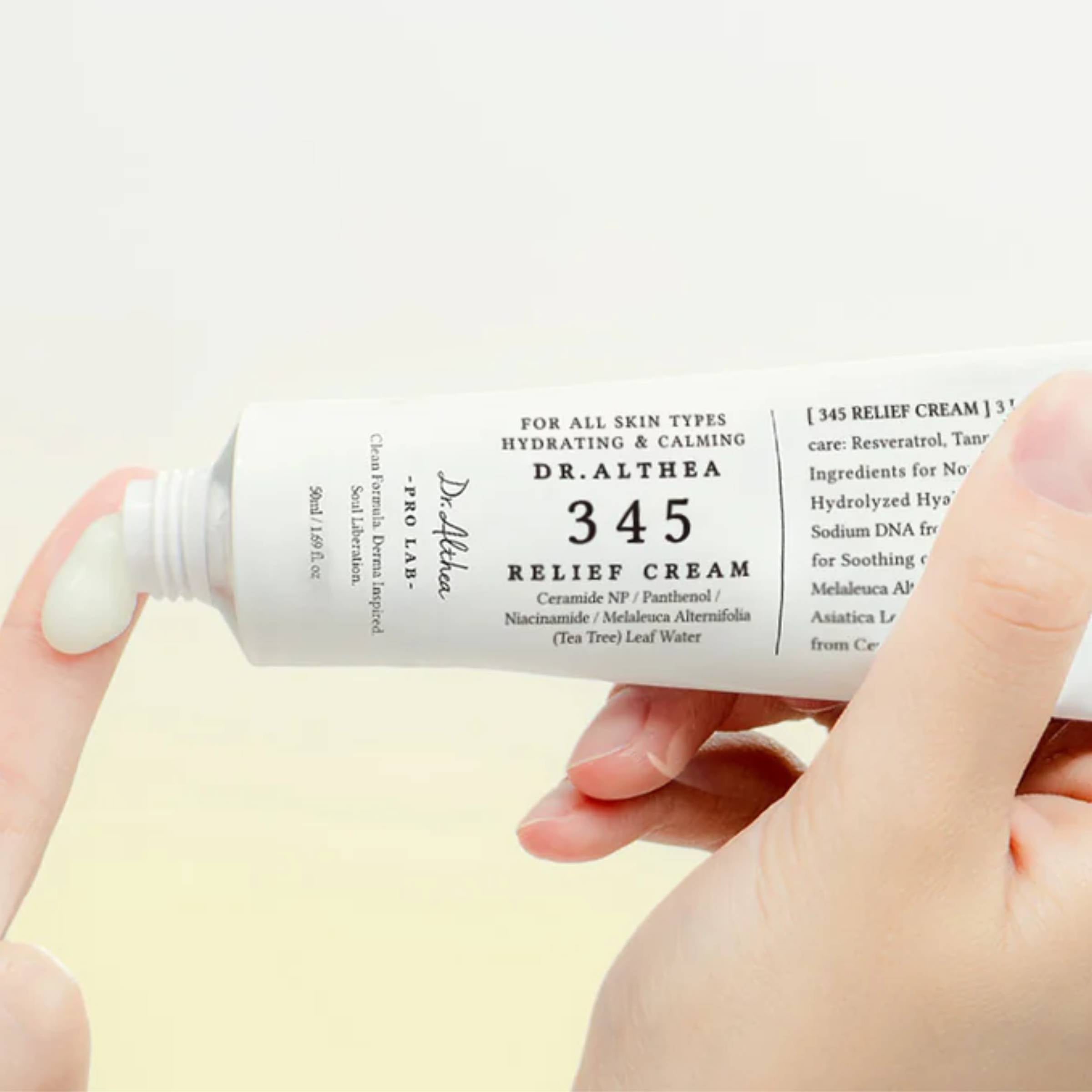 Dr. Althea 345 Relief Cream being applied with a finger on a light background