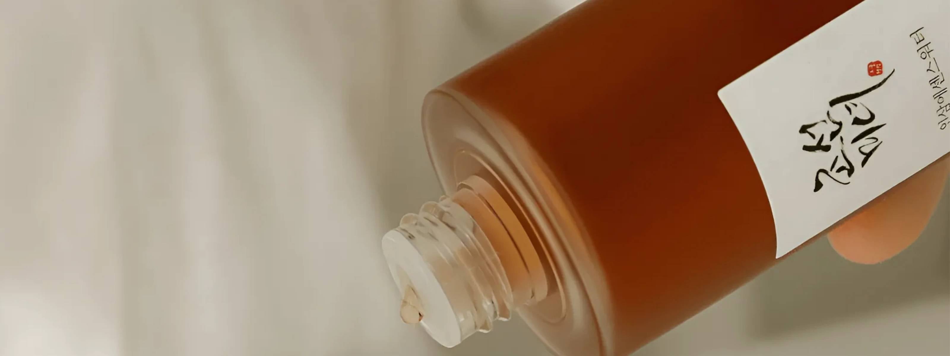 Bottle of Beauty of Joseon product with a dropper on a light background