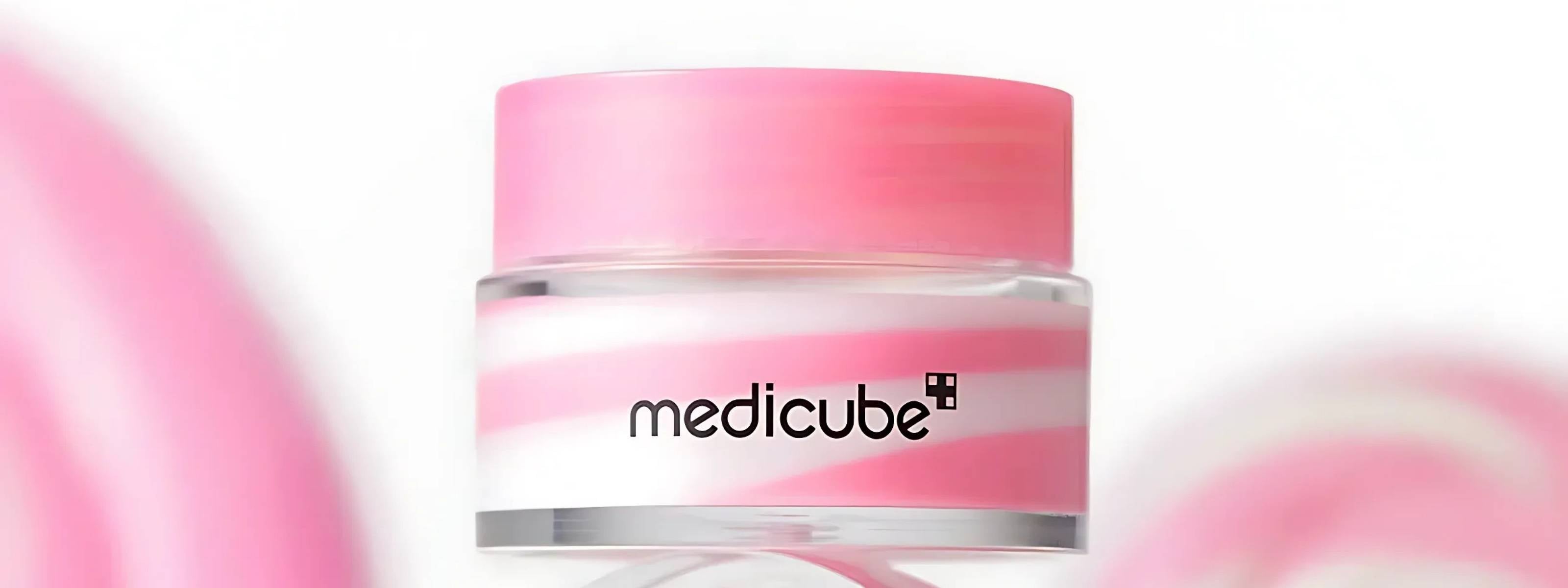 Pink and white jar with 'medicube' branding on a light pink background