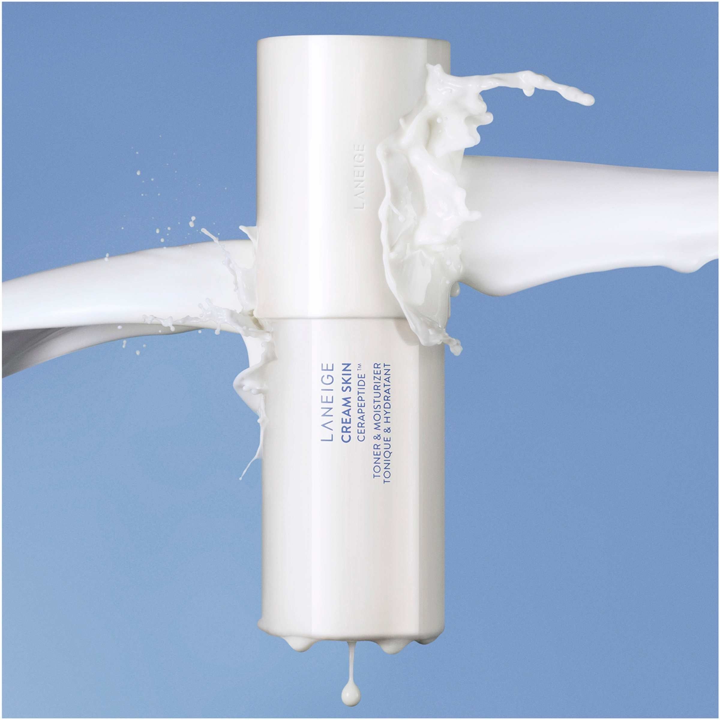 Laneige skincare product with cream being squeezed out on a blue background