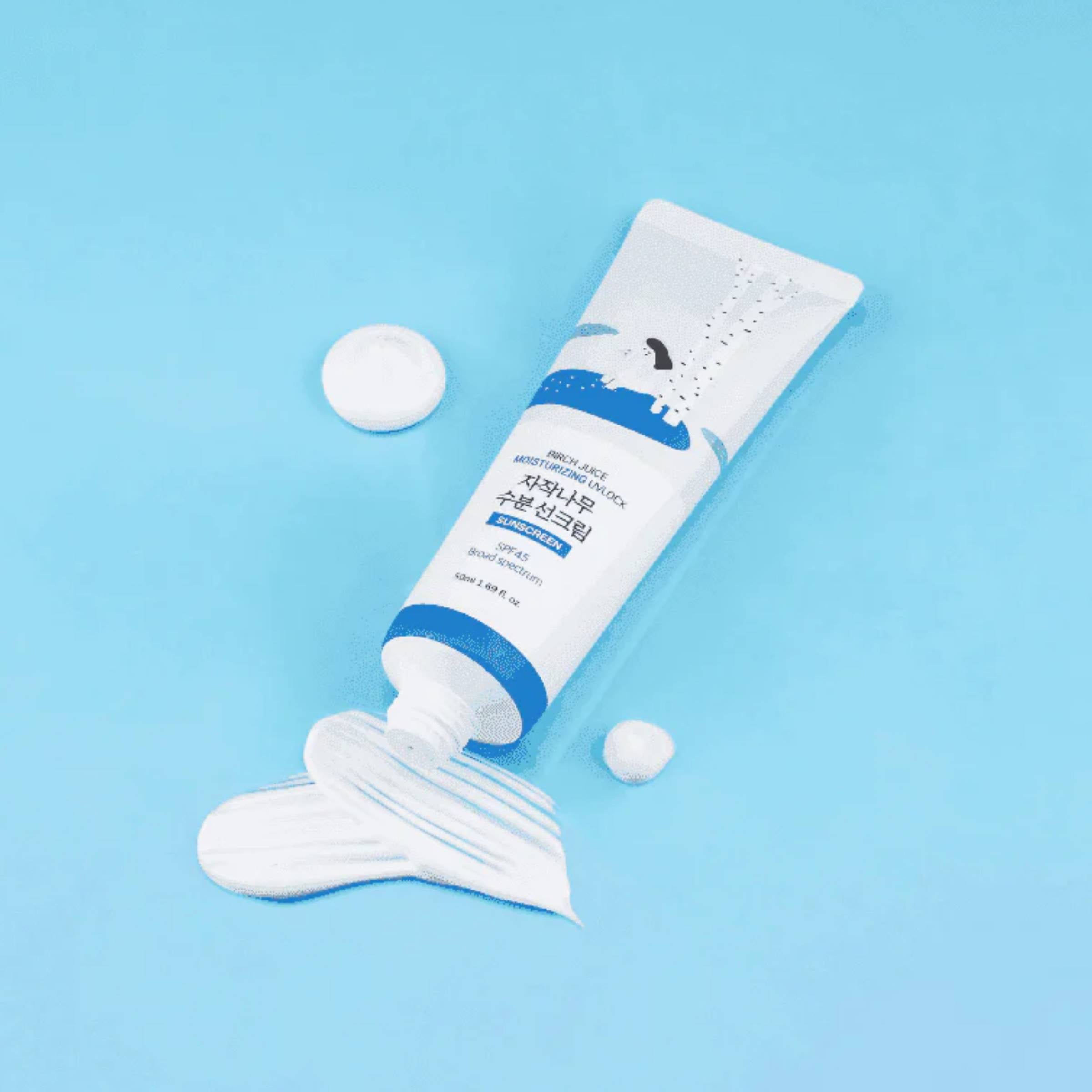 Round Lab Birch Juice Moisturizing Sunscreen on a blue background