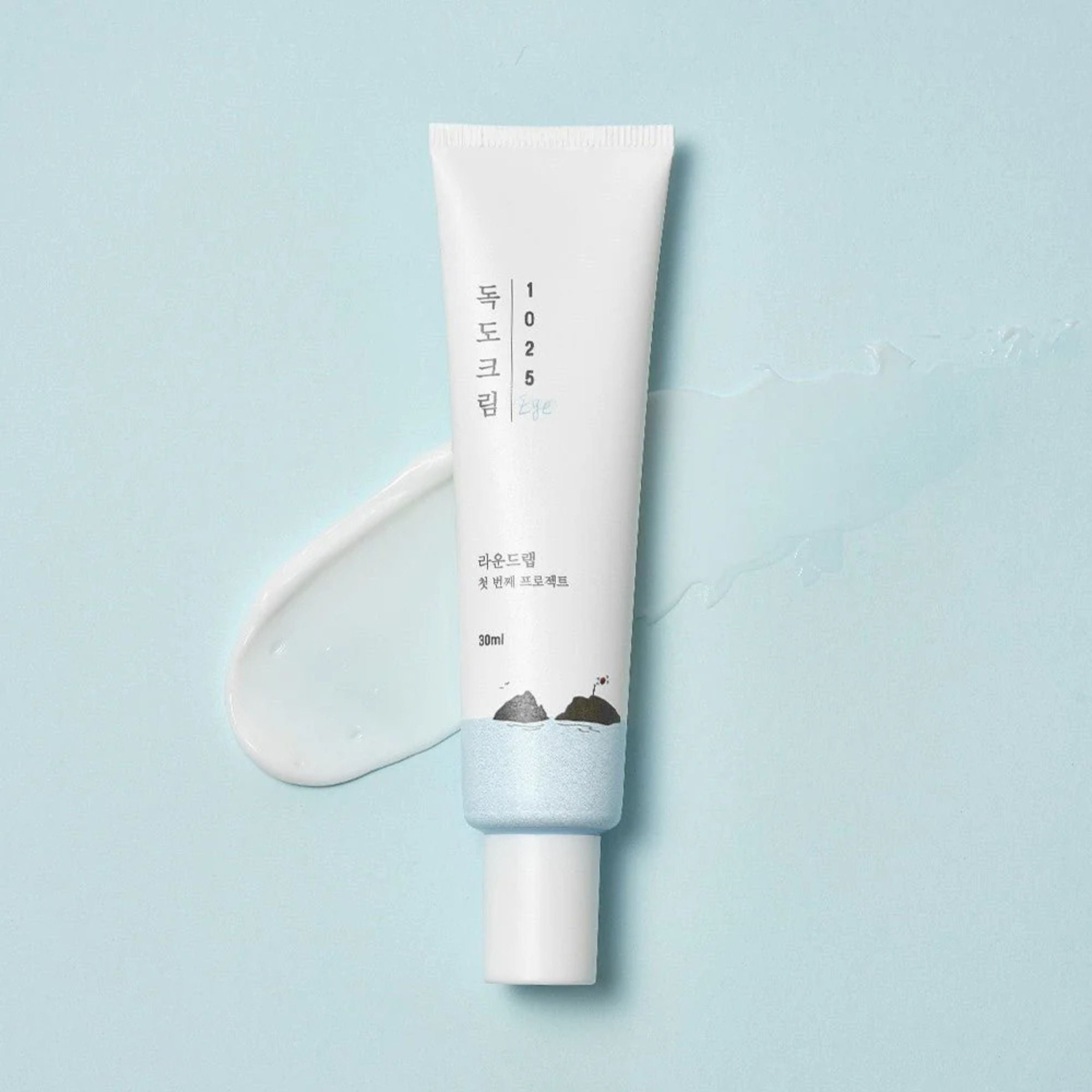 Skincare product with branding on a light blue background