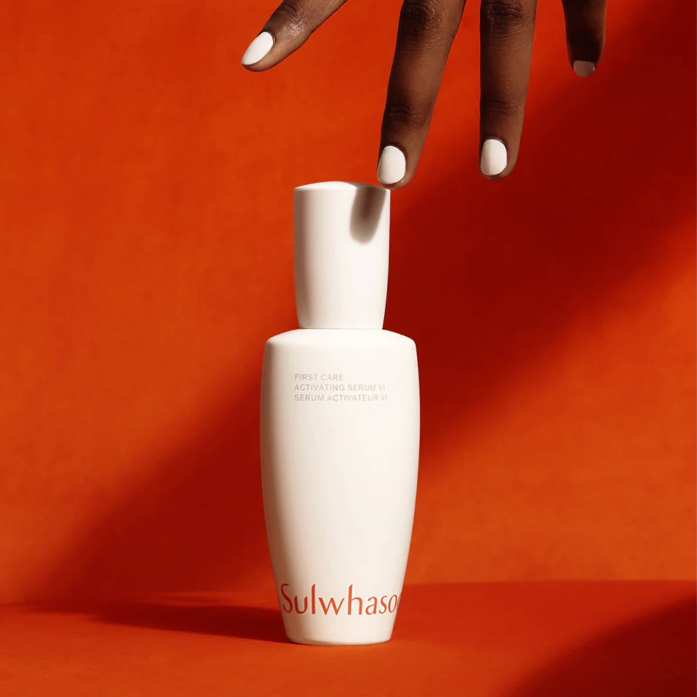 White Sulwhasoo bottle on an orange background