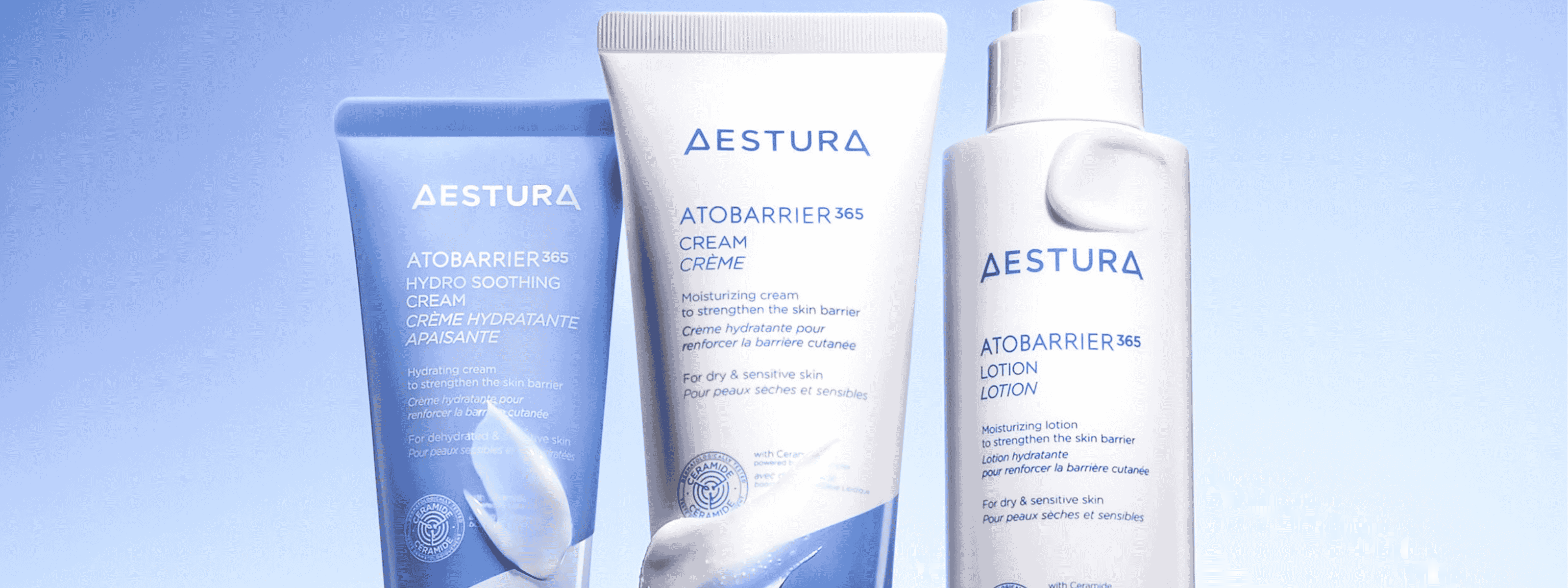 Aestura skincare products on a light blue background