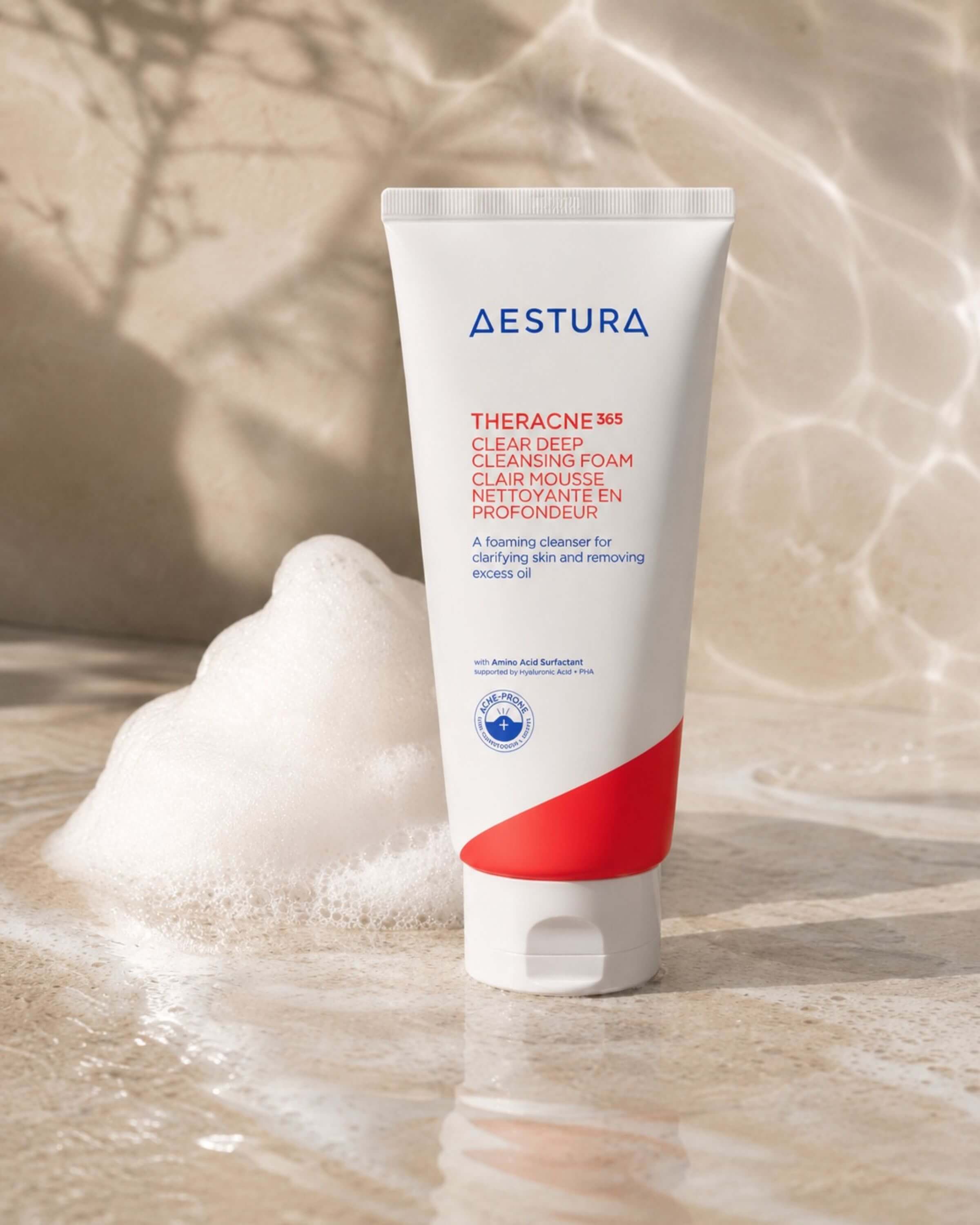 Tube of Aestura Theracne 365 Clear Deep Cleansing Foam on a textured beige background