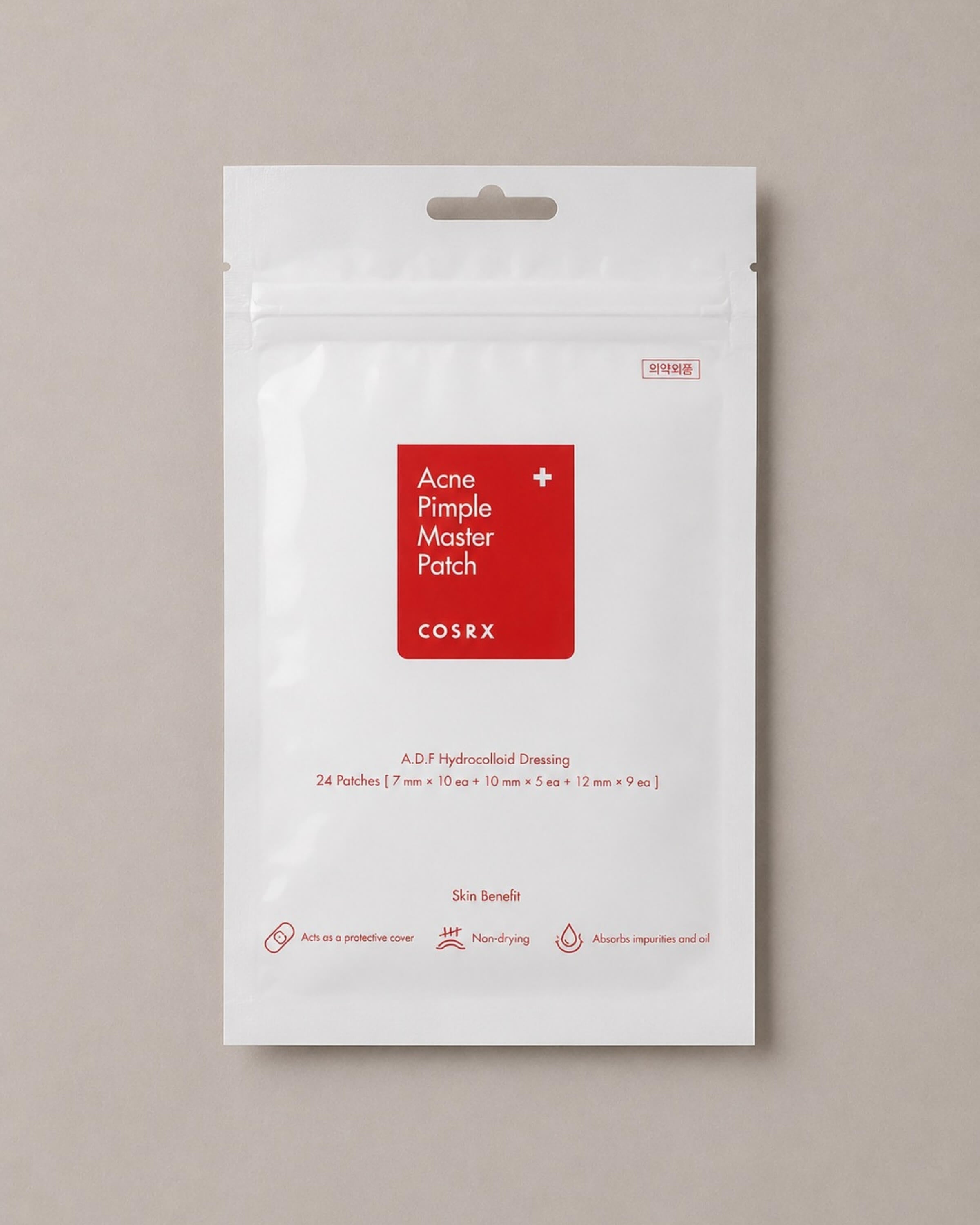 Cosrx Acne Pimple Master Patch packaging on a beige background