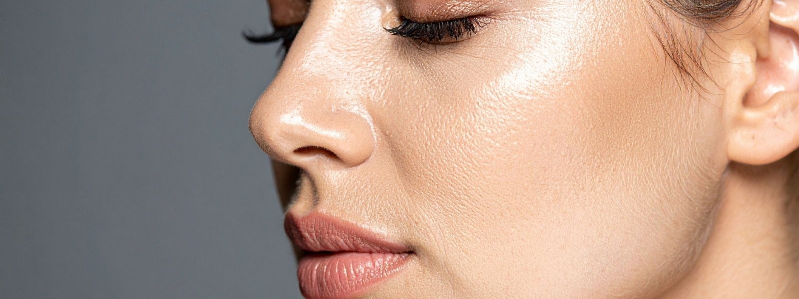 Close-up of a woman's face with a neutral background