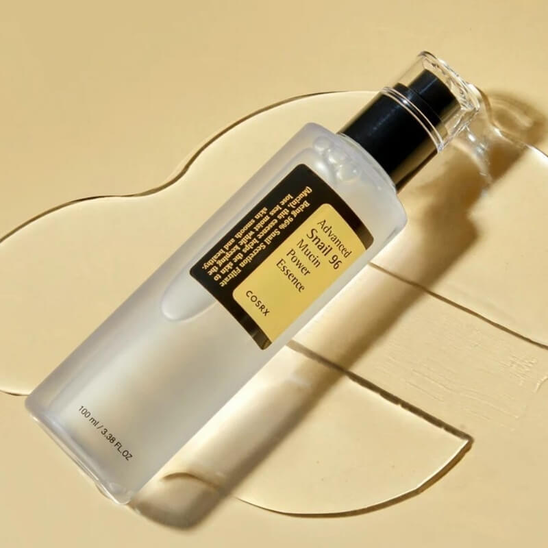 COSRX Advanced Snail 96 Mucin Power Essence bottle on a beige background