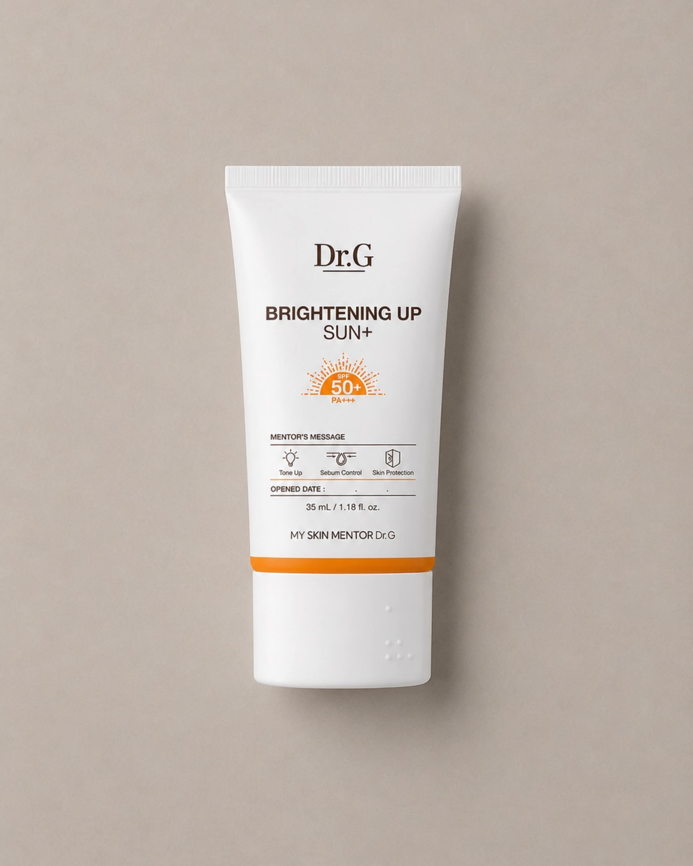 Dr.G Brightening Up Sun+ sunscreen tube on a beige background