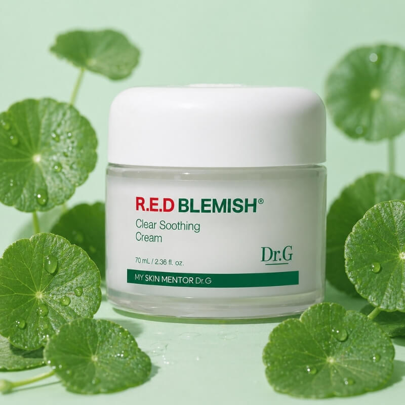 Dr G Red Blemish Clear Soothing Cream next to Cica leaves against a green background