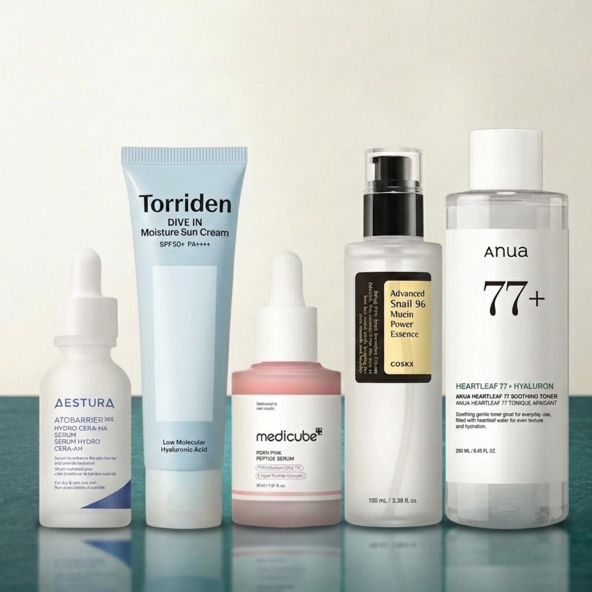 Collection of skincare products with visible brand names on a reflective surface.