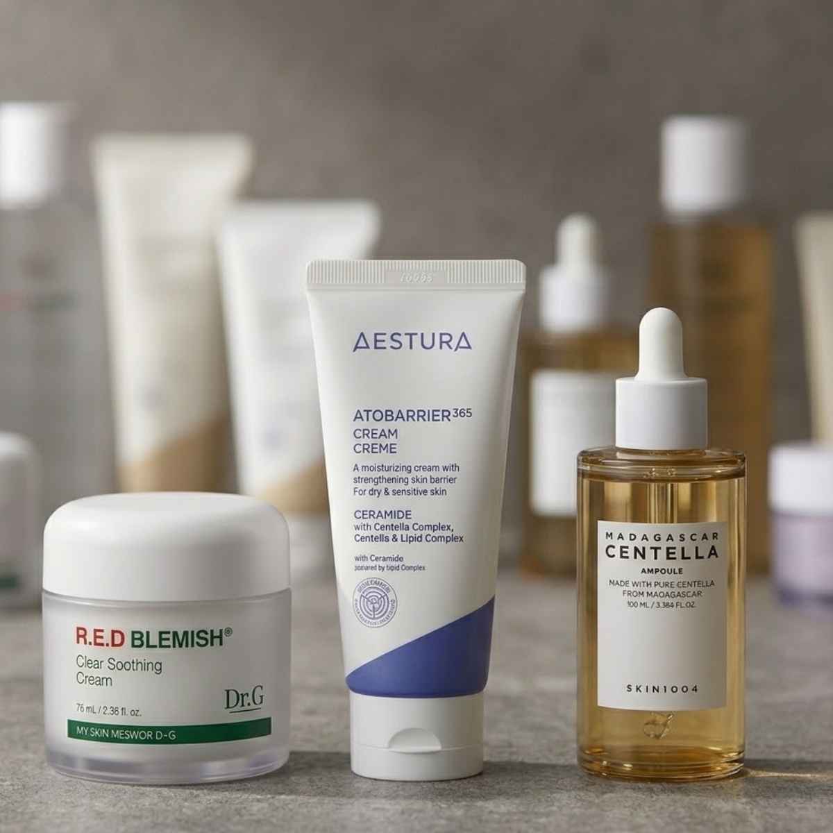 Skincare products including a tube of Aestura cream, a jar of Dr G Cream and SKIN1004 ampoule
